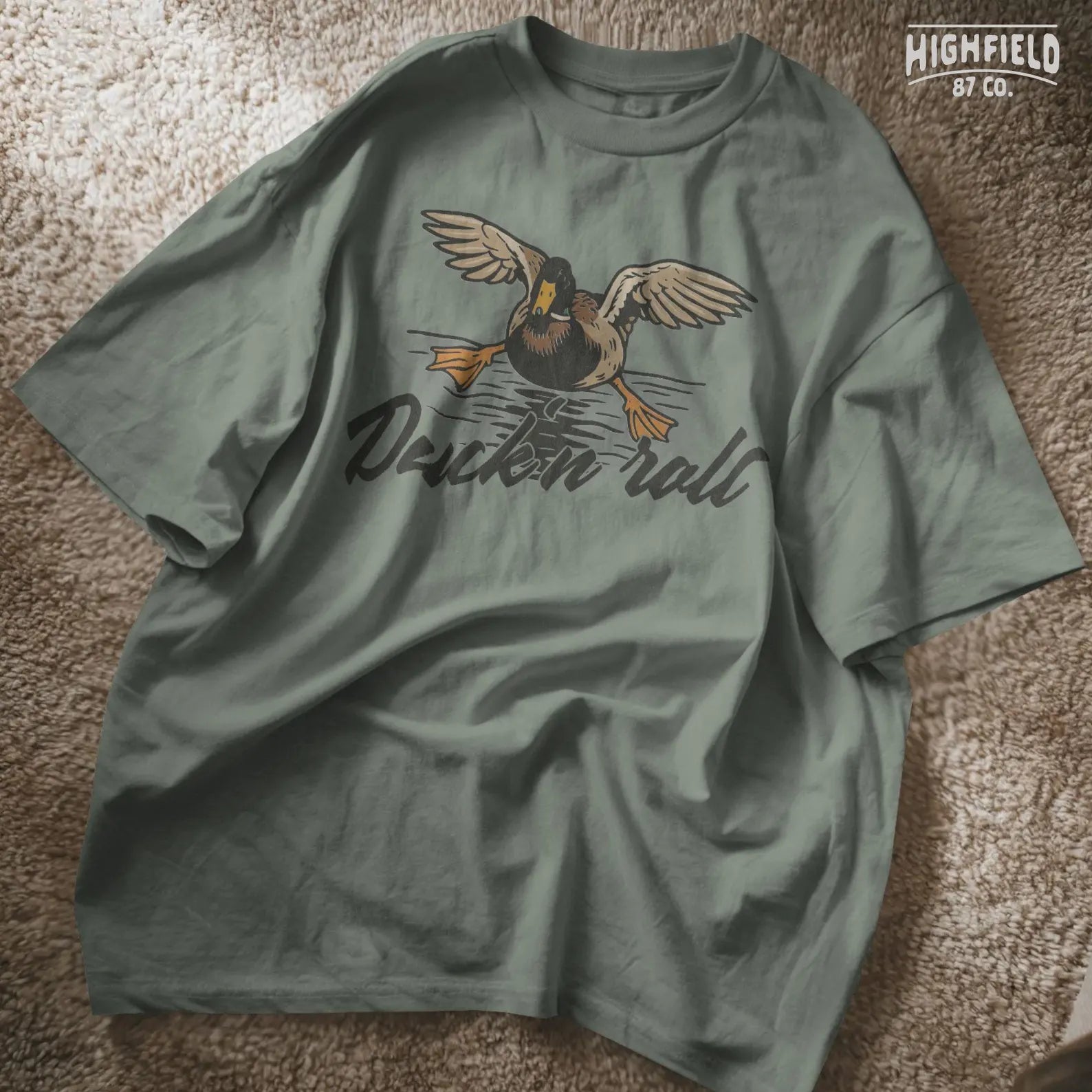 Bold illustration of a duck gliding onto water surface with comic timing, paired with the phrase “Duck 'n Roll.” A fun design for duck hunters and outdoor lovers.