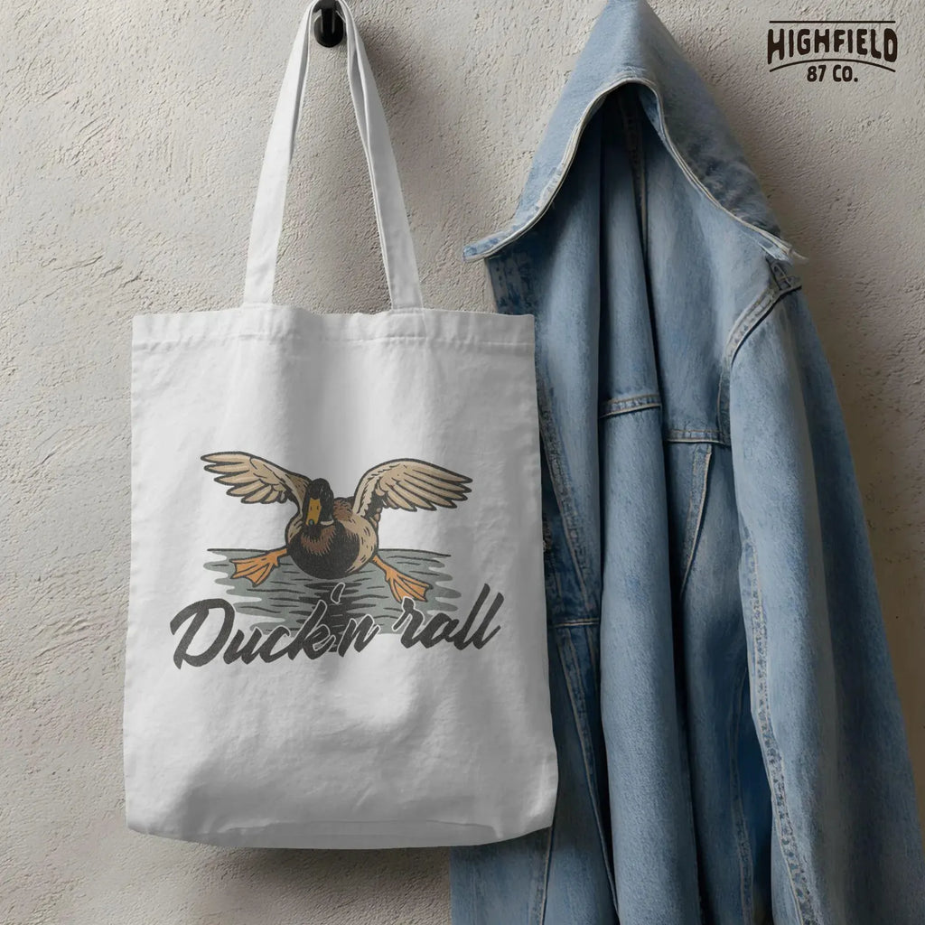 Duck-themed digital artwork featuring a mallard in flight and energetic font saying “Duck 'n Roll.” Great for waterfowl enthusiasts and craft project files.