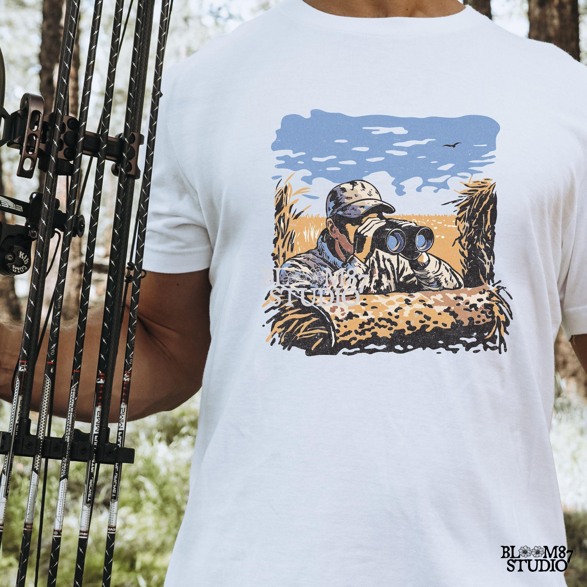 “Illustrated camouflage hunter peeking through binoculars from a duck blind, surrounded by tall grass, with a blue sky and golden field background. A detailed digital hunting-themed design, perfect for outdoorsmen, wildlife lovers, and hunting gear.”