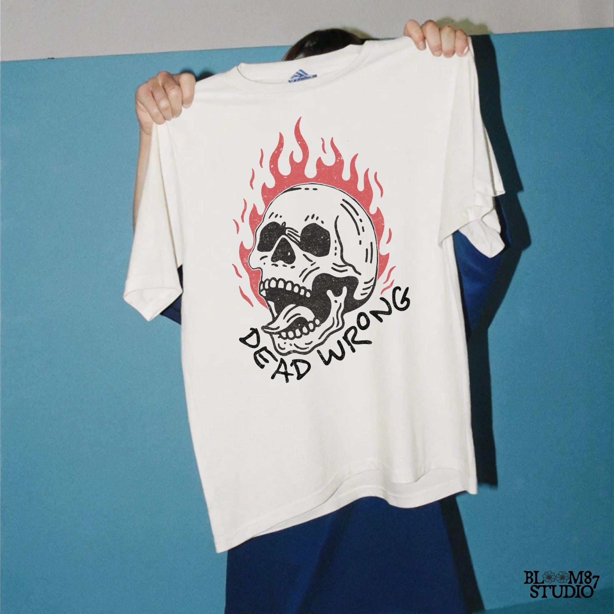 Vintage-style flaming skull illustration with a gothic, tattoo-inspired design. Perfect for edgy artwork, biker graphics, and rock-inspired prints.