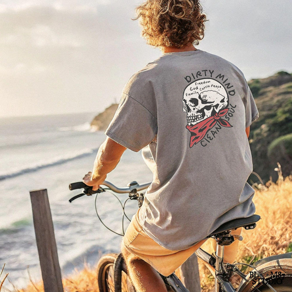 Vintage-style illustration of a cowboy skull wearing a red bandana, featuring handwritten words about freedom, family, and cattle. Perfect for western decor and apparel.