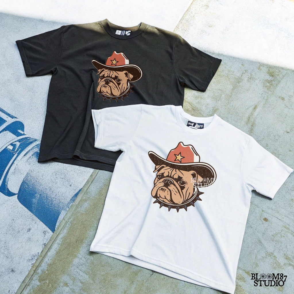 Vintage-style illustration of a tough bulldog wearing a cowboy hat with a star and a spiked collar. Perfect for western decor, rodeo designs, and apparel.