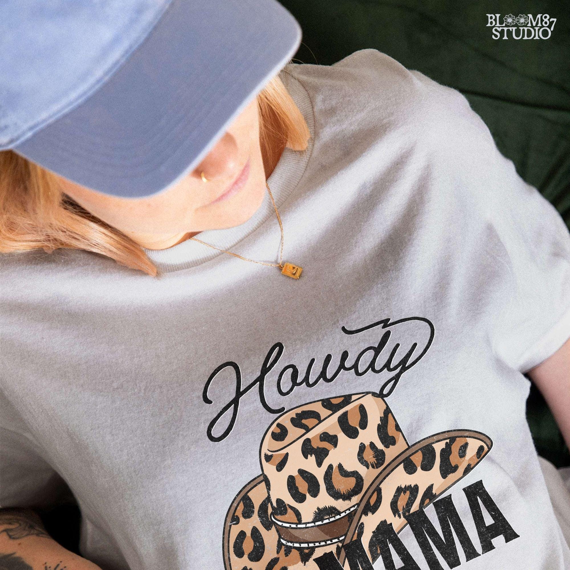 Leopard print cowboy hat with "Howdy Mama" text in a western-style font. Perfect for country-loving moms, rodeo fashion, and cowgirl designs.