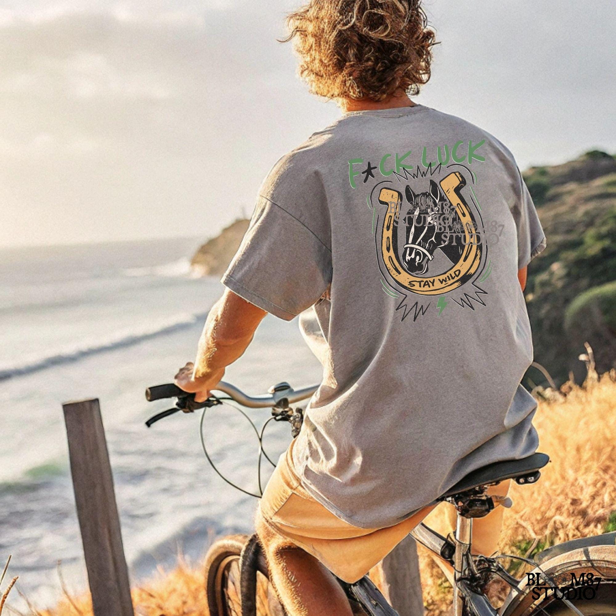 Vintage Western-style PNG featuring a horse inside a horseshoe with lightning bolts, the phrase “Stay Wild,” and an edgy rebellious message.