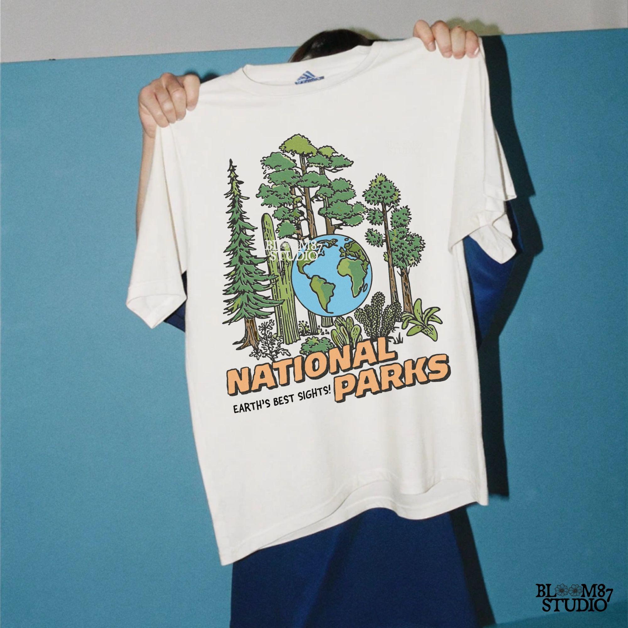 A nature-inspired PNG featuring a globe surrounded by diverse trees and plants, with the words “National Parks” in bold lettering. Perfect for outdoor lovers.