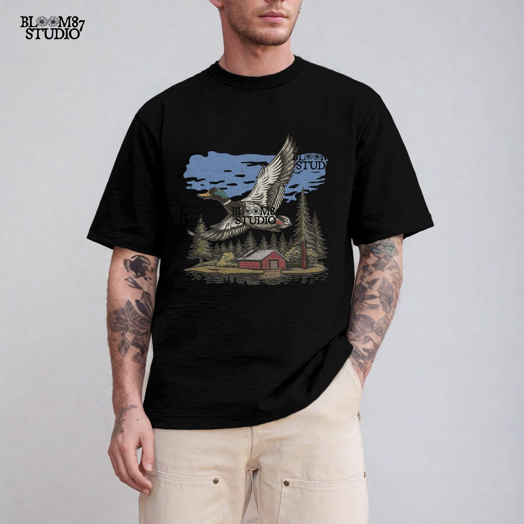 Vintage illustration of a mallard duck flying over a red cabin by the lake, surrounded by pine trees. Perfect for rustic lodge decor and wildlife art prints.