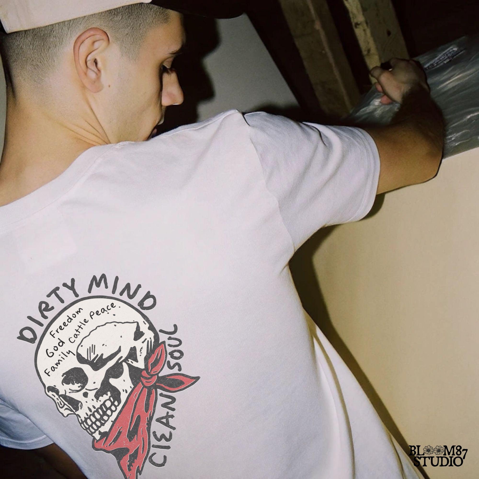 Vintage-style illustration of a cowboy skull wearing a red bandana, featuring handwritten words about freedom, family, and cattle. Perfect for western decor and apparel.