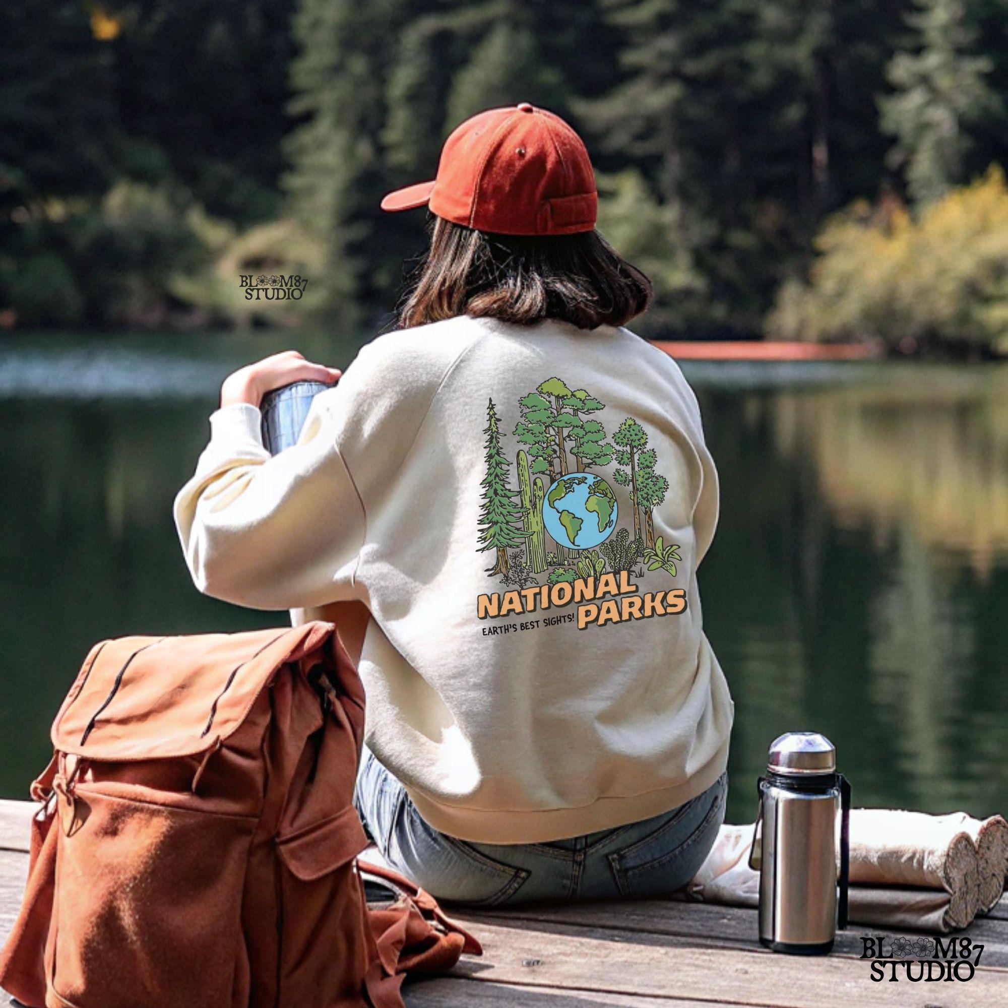 A nature-inspired PNG featuring a globe surrounded by diverse trees and plants, with the words “National Parks” in bold lettering. Perfect for outdoor lovers.