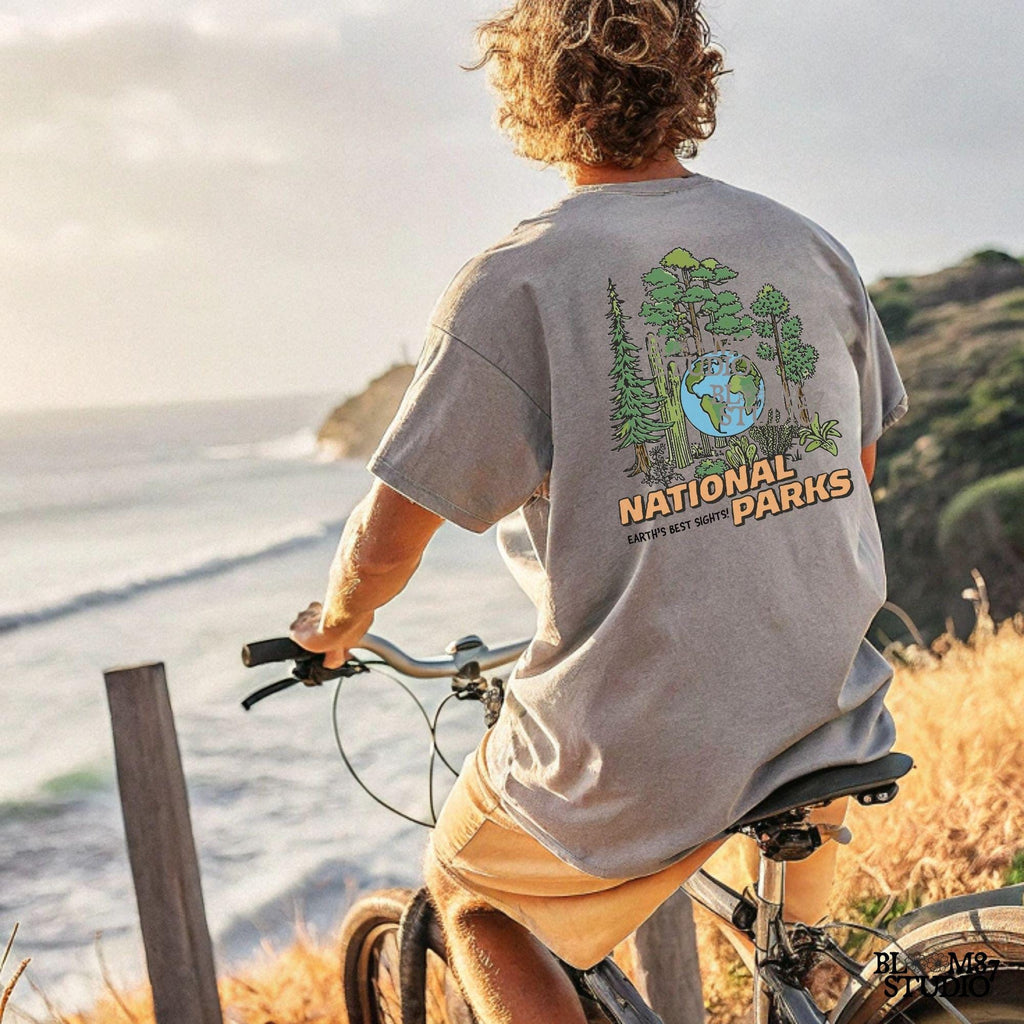 A nature-inspired PNG featuring a globe surrounded by diverse trees and plants, with the words “National Parks” in bold lettering. Perfect for outdoor lovers.