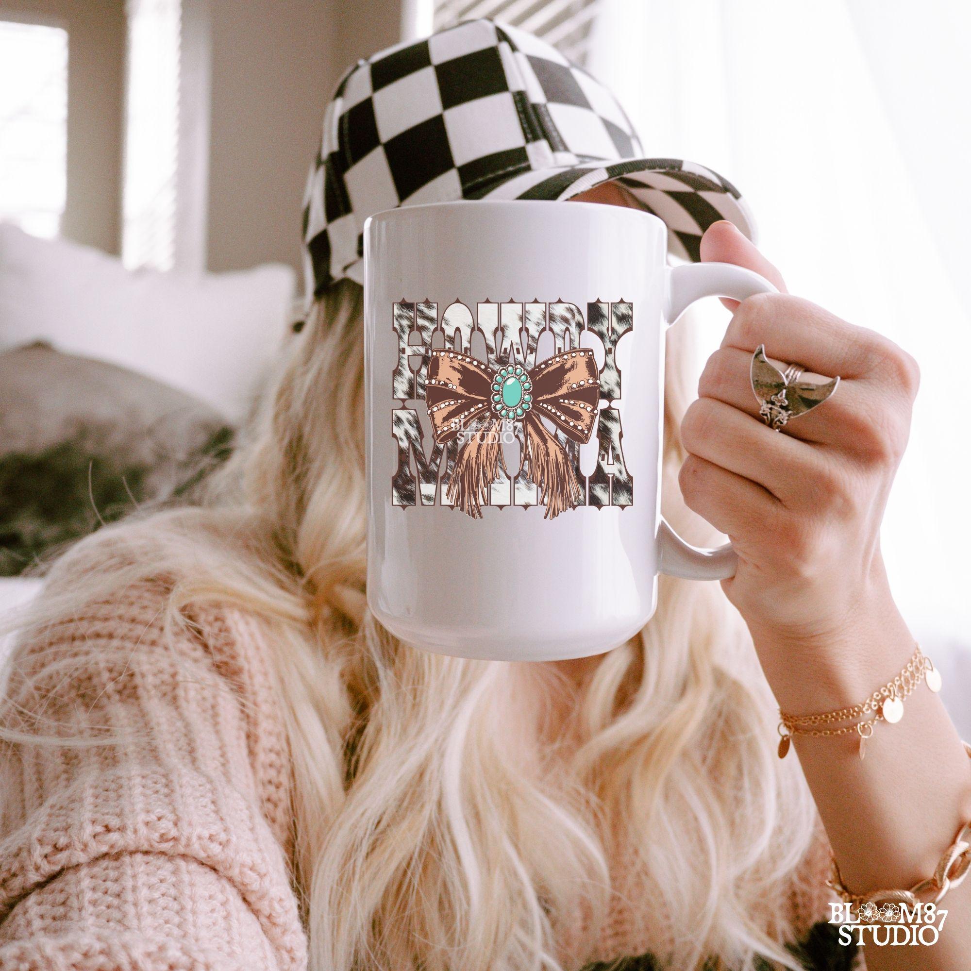 This “Howdy Mama” PNG features a bold western-style font with a cow print background and a detailed fringe bow with a turquoise concho. A stylish country design, perfect for Mother’s Day gifts, rodeo moms, and western-loving women. Ideal for sublimation on T-shirts, mugs, tumblers, and tote bags. High-resolution transparent PNG for easy crafting and DIY projects.