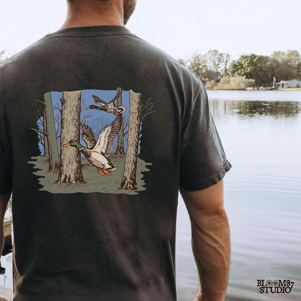 ducks in woods graphic, rustic flying mallards png, duck season print file, hunting woods scene, mallard digital png, forest flight design, ducks in trees silhouette, mallard pair flying over woods, rural nature birds png, outdoor ducks art