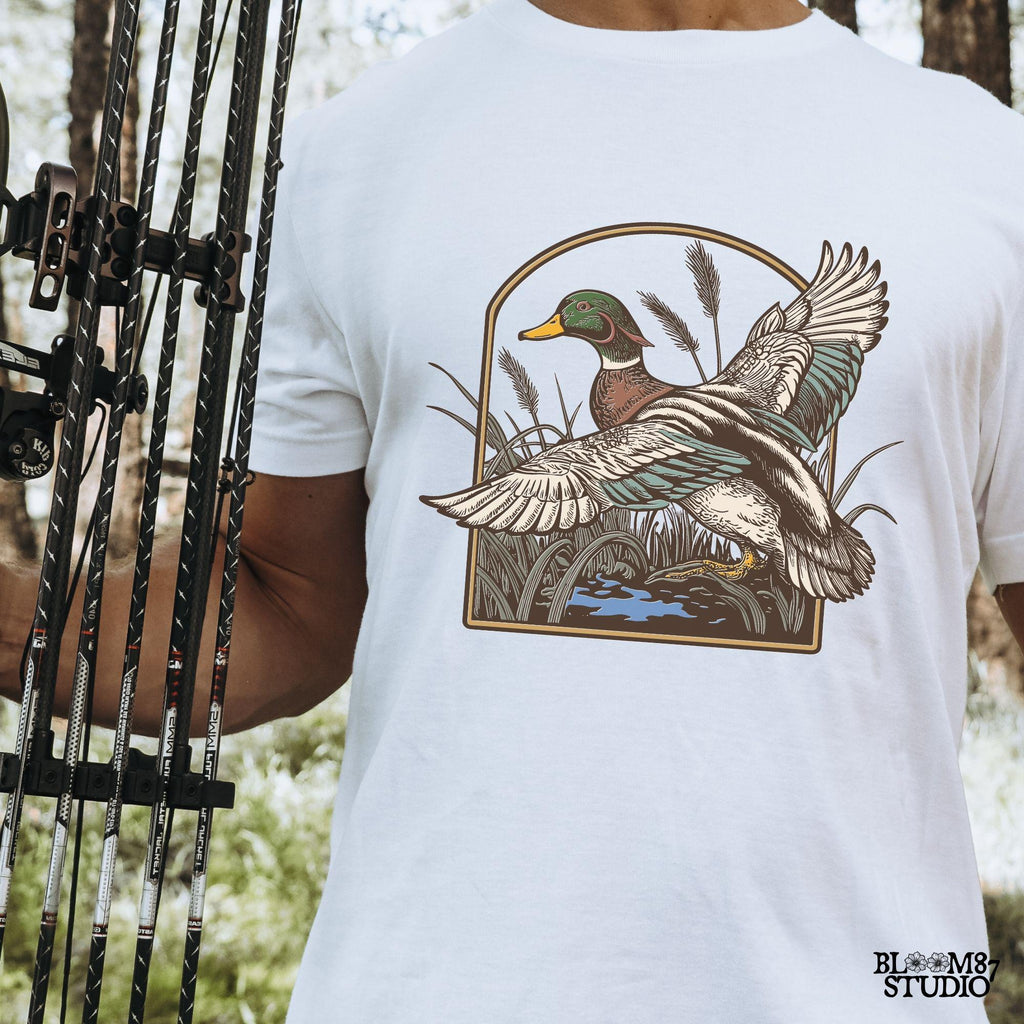 mallard flying illustration, duck marshland art, water bird png file, game bird design, hunting lodge decor png, wild duck flying png, mallard vintage clipart, high-res duck artwork, duck wings open png, flying waterfowl silhouette