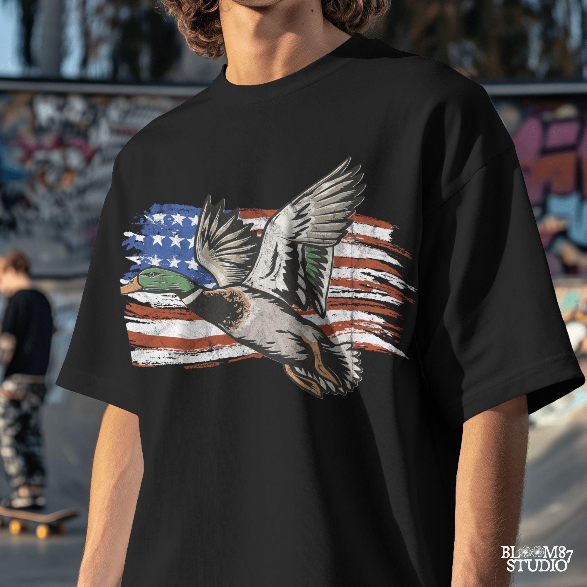 flying mallard design, waterfowl sportsman clipart, duck lodge decor png, american country duck art, flag themed outdoors png, wild duck digital, patriotic hunting shirt, flag and feathers graphic
