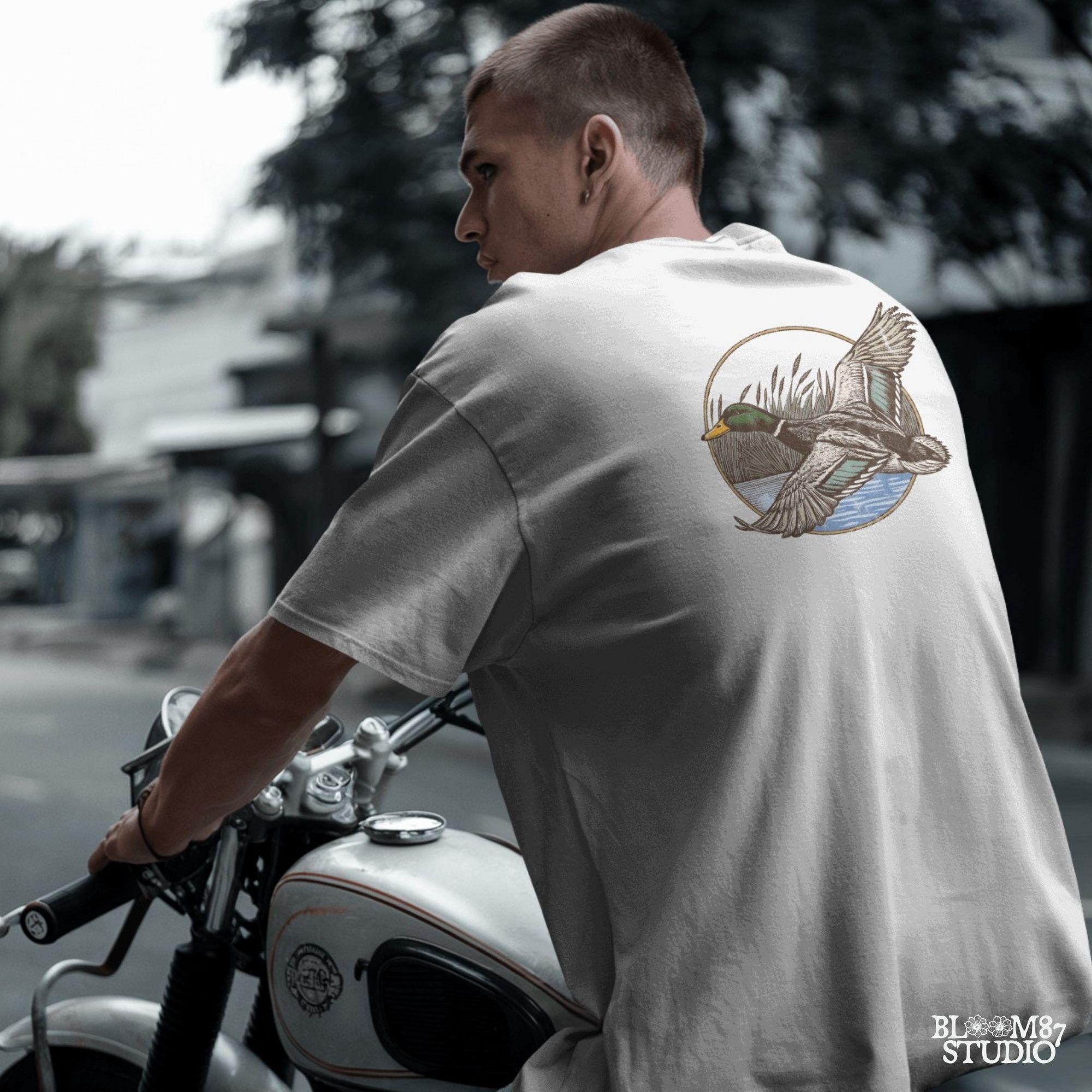 "Vintage flying mallard duck PNG clipart in marsh scene, rustic wildlife sublimation design for duck hunting shirts and outdoor gear"