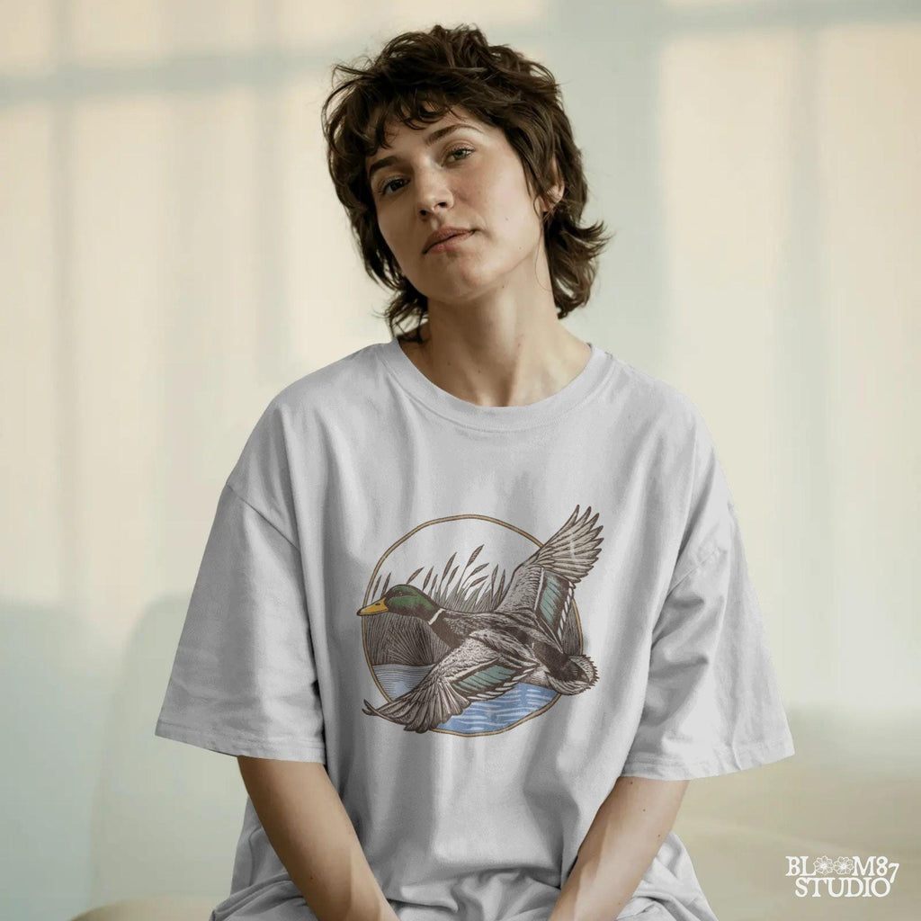 "Vintage flying mallard duck PNG clipart in marsh scene, rustic wildlife sublimation design for duck hunting shirts and outdoor gear"