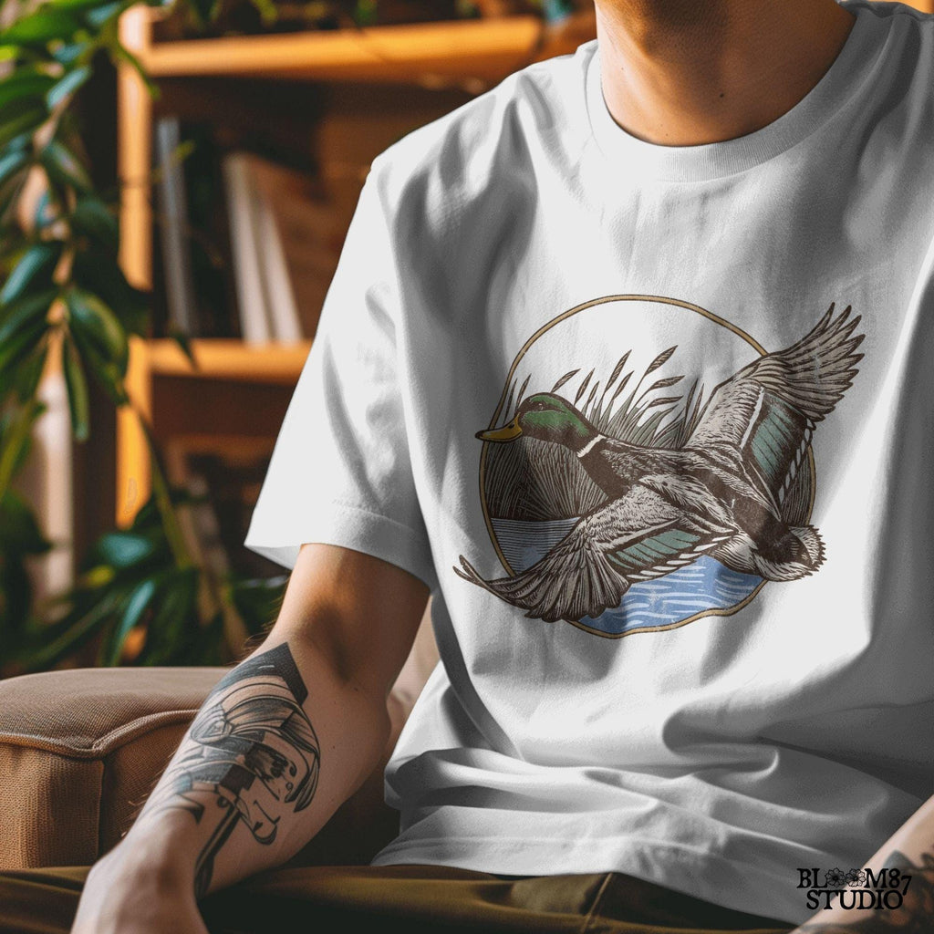 "Vintage flying mallard duck PNG clipart in marsh scene, rustic wildlife sublimation design for duck hunting shirts and outdoor gear"