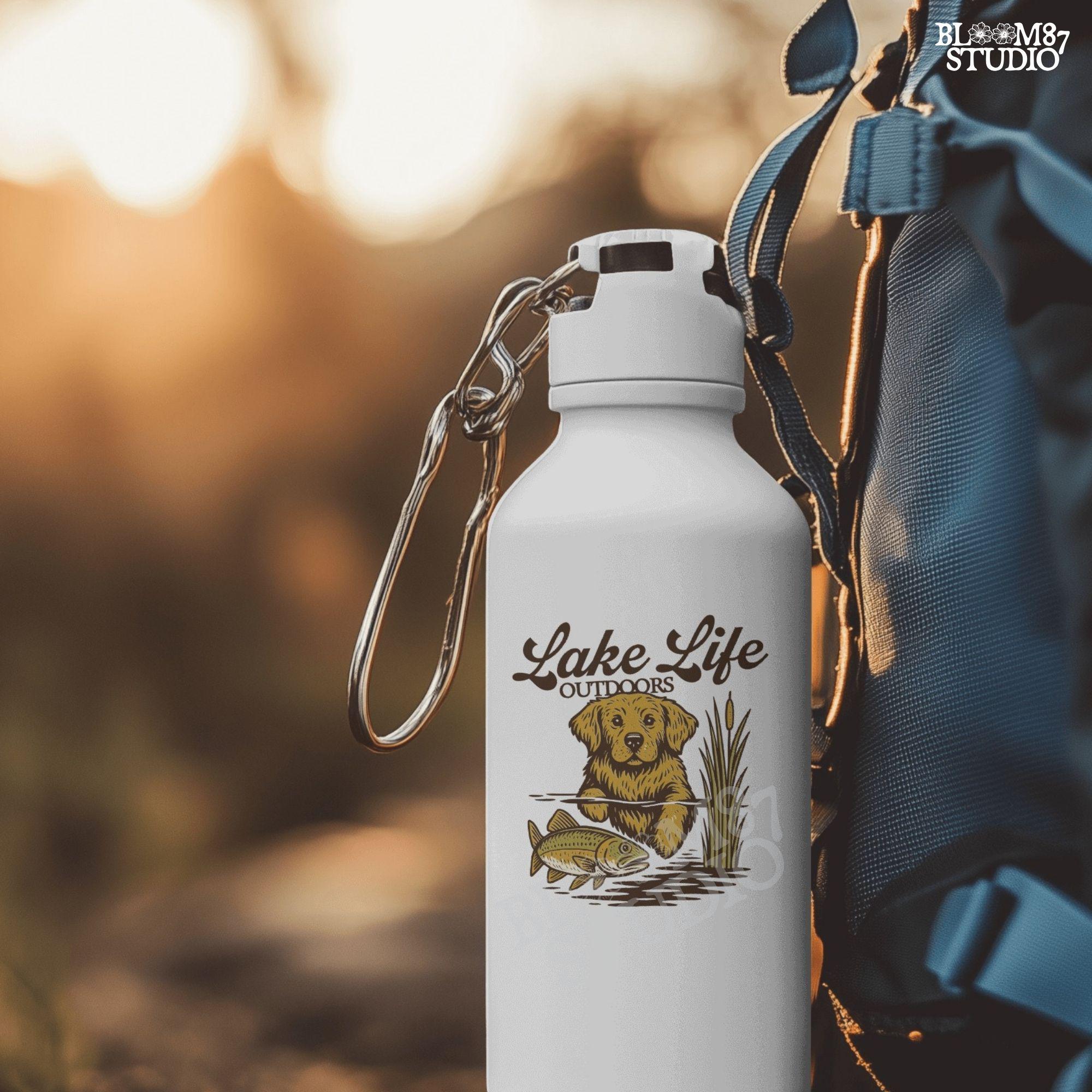 Golden Retriever dog enjoying lake life outdoors with fish in rustic nature setting — perfect for lake house and fishing sublimation designs