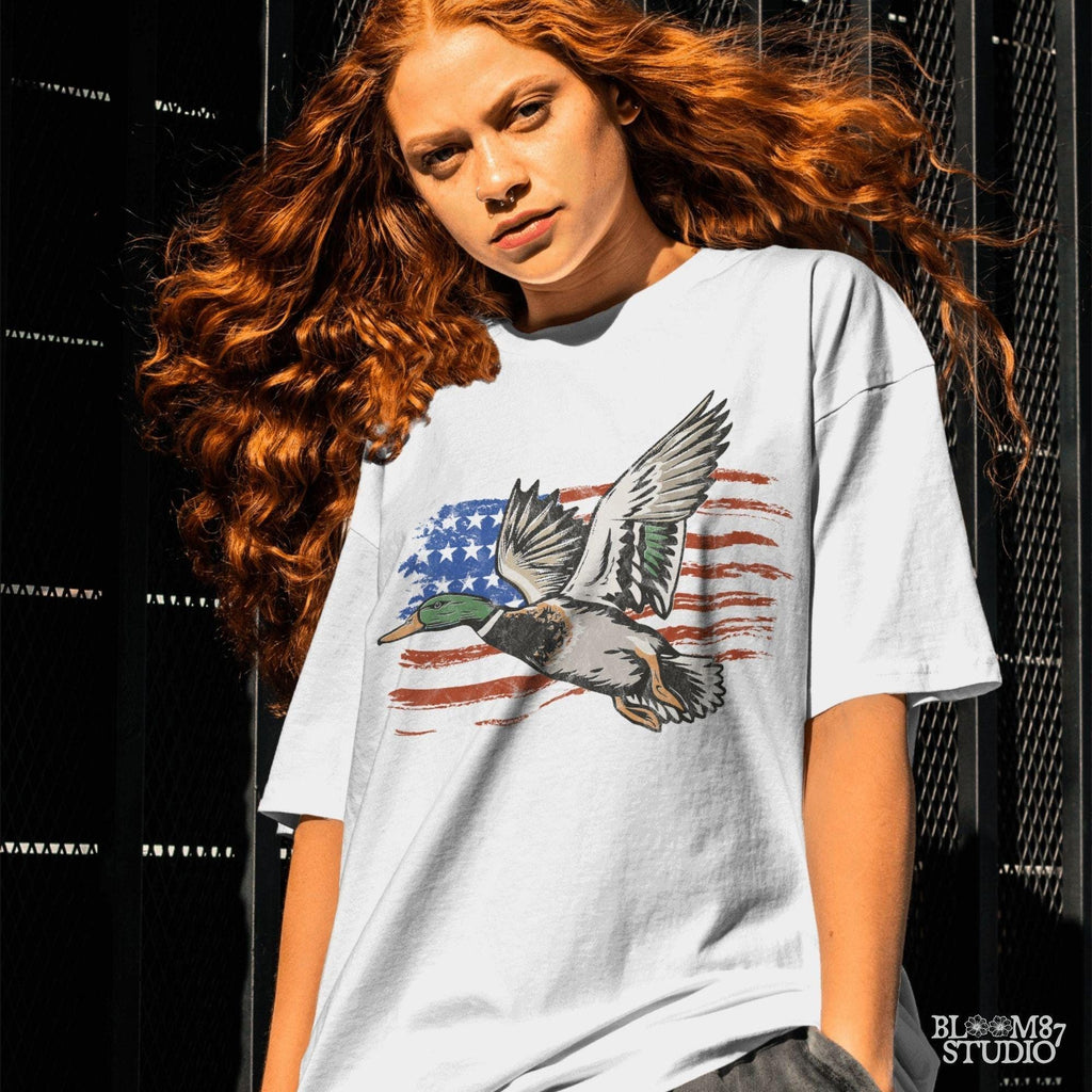 mallard in flight file, duck hunting gear png, patriotic bird hunter shirt, americana wildlife printable, flag bird art, usa duck club design, outdoor retreat png, freedom flight design, 4th of july hunting clipart