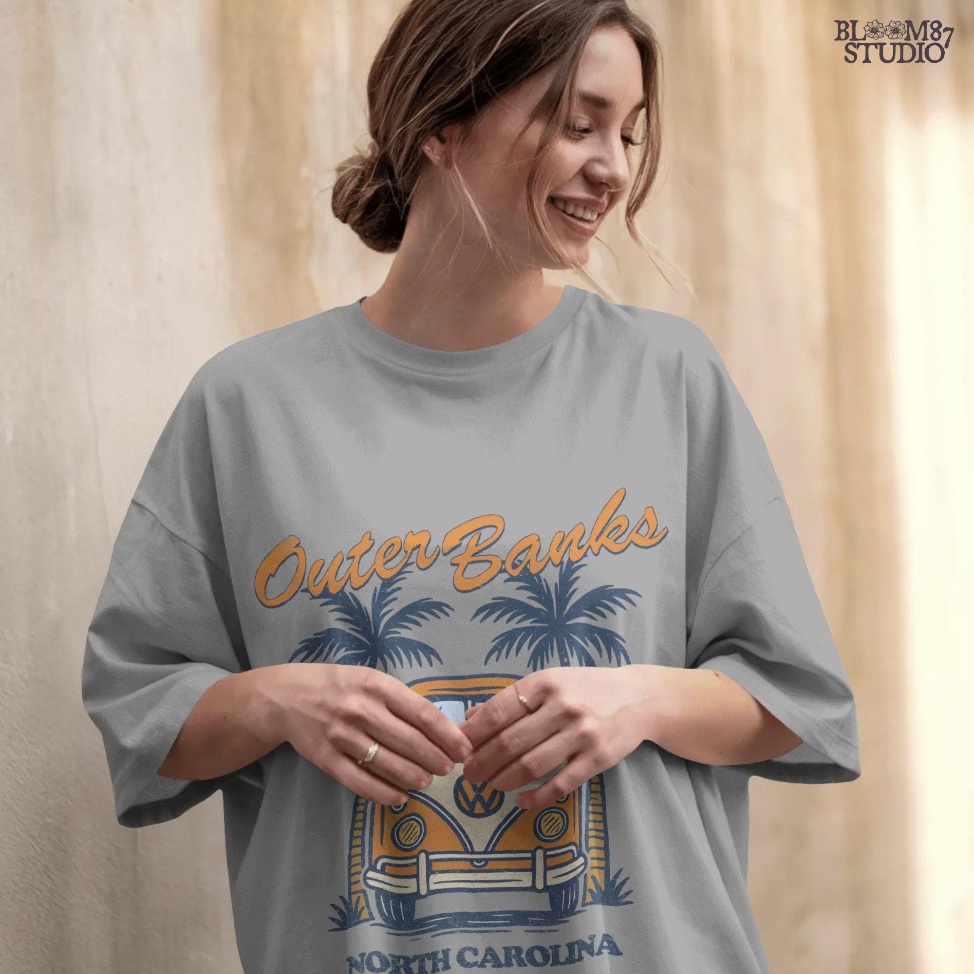 Vintage VW van parked between palm trees with “Outer Banks North Carolina” text, perfect for summer road trip beach vibes design.