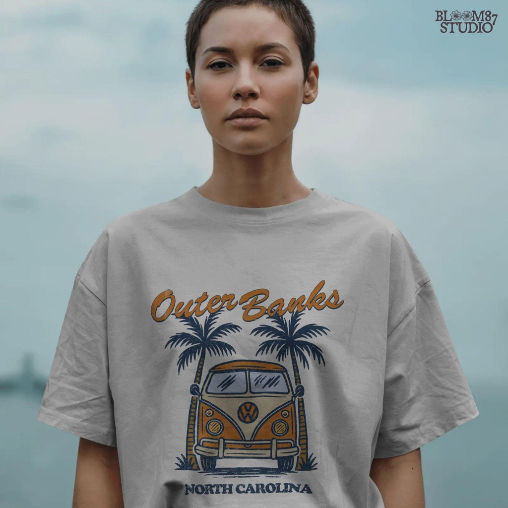 Vintage VW van parked between palm trees with “Outer Banks North Carolina” text, perfect for summer road trip beach vibes design.