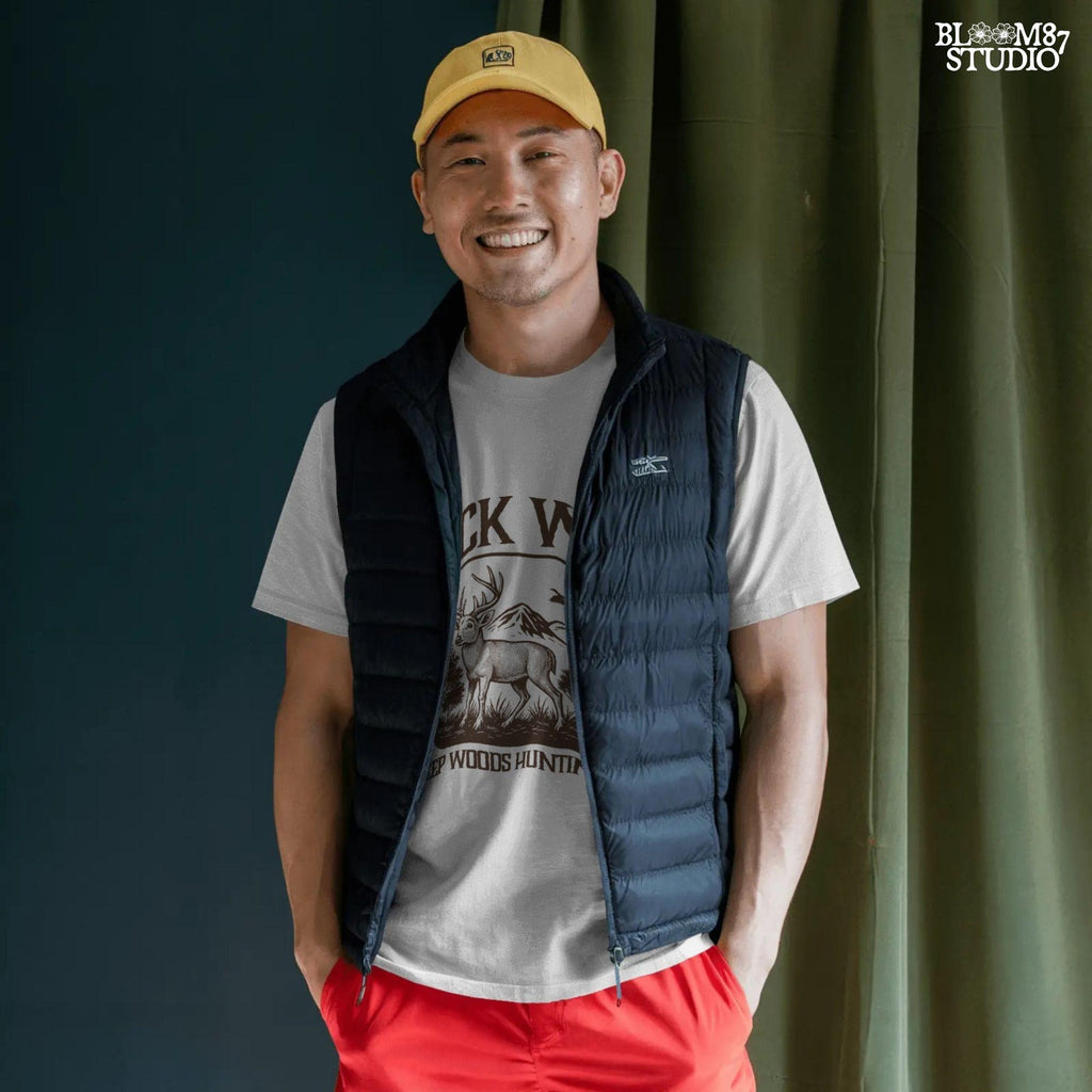 Illustration of a buck in the forest with mountains, a watchtower, and a bird, framed by the text “Buck Wild – Deep Woods Hunting Club”.