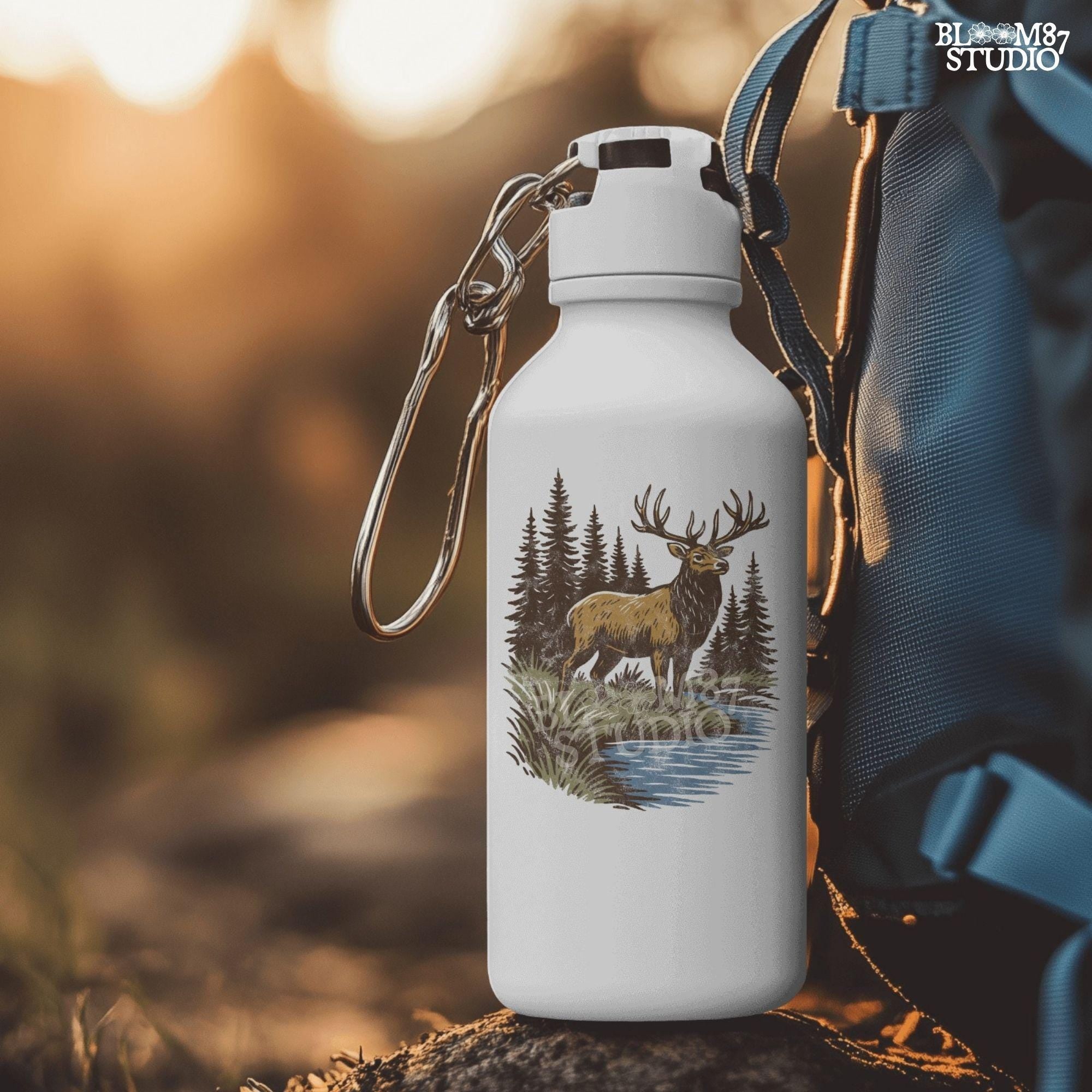 Illustration of a majestic elk with large antlers standing by a stream, surrounded by tall pine trees in a forest setting.