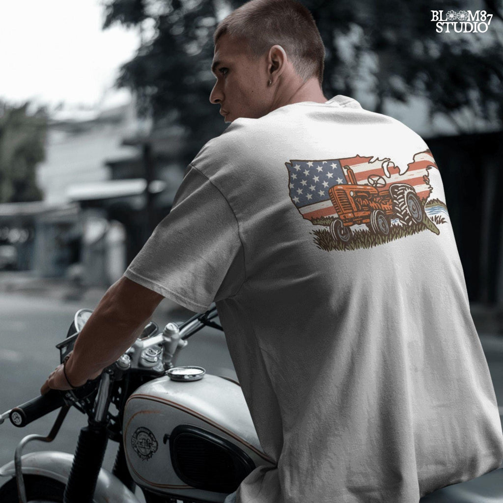 Rustic orange tractor in front of USA map with American flag overlay, vintage patriotic summer farm PNG design.