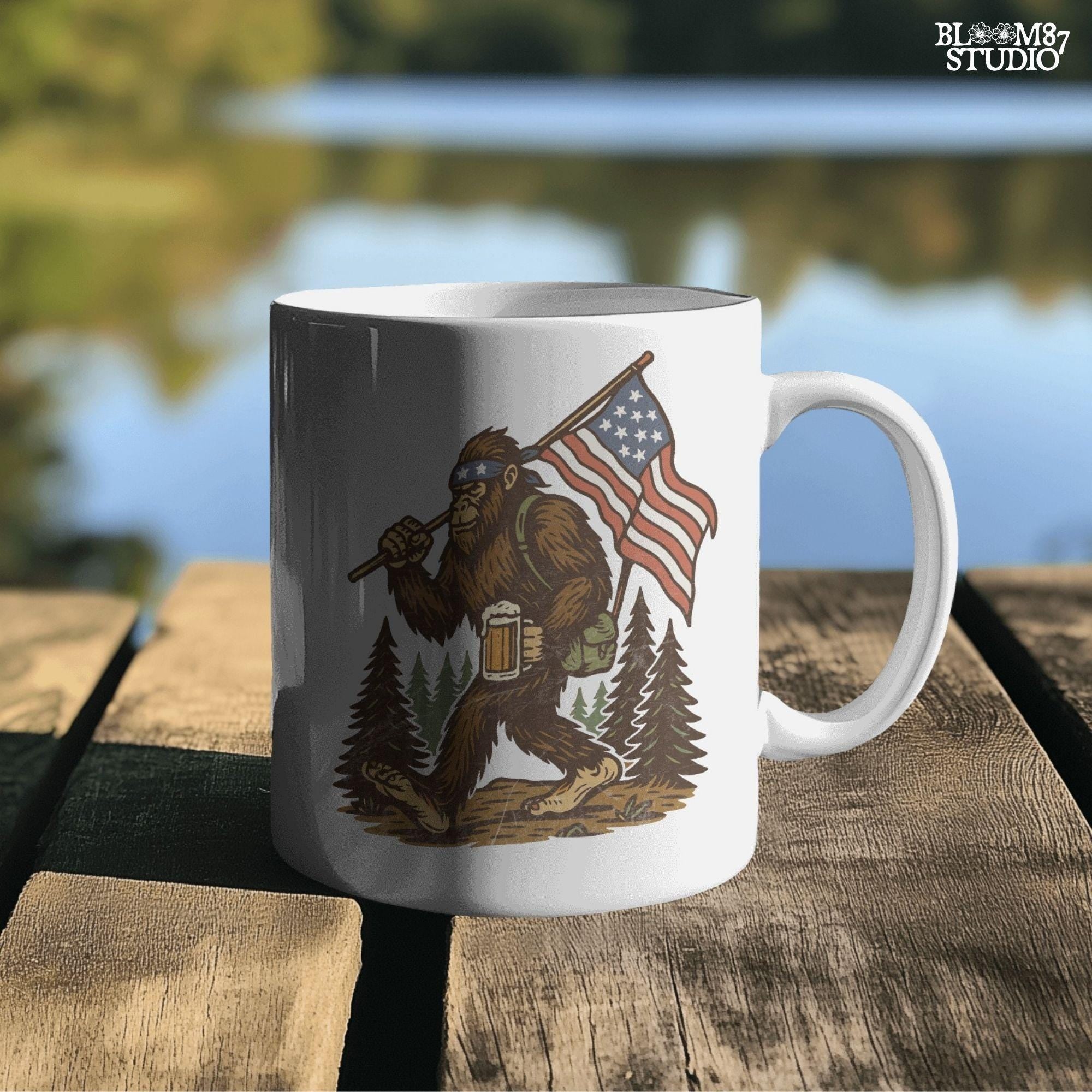 Patriotic bigfoot carrying American flag and beer mug in forest, funny summer USA PNG design.