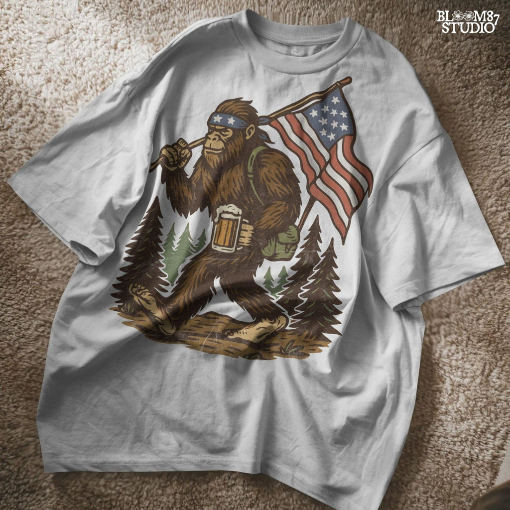 Patriotic bigfoot carrying American flag and beer mug in forest, funny summer USA PNG design.