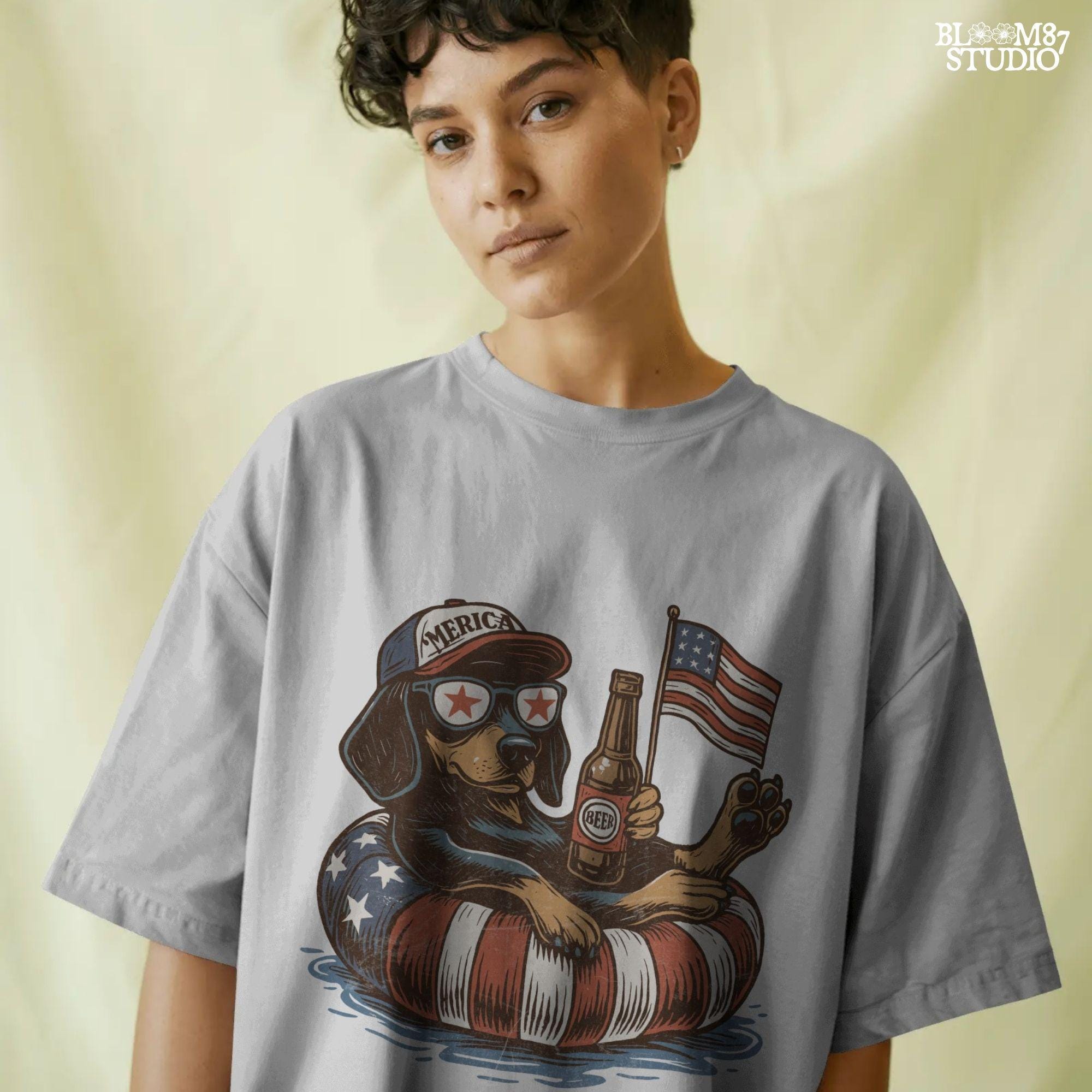 Funny patriotic dachshund dog floating in pool with American flag inner tube, wearing USA sunglasses and holding beer bottle.