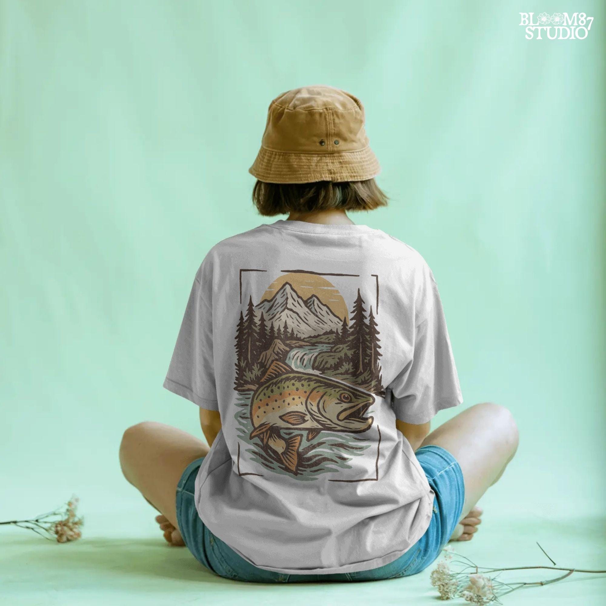 Colorful trout leaping in front of a scenic mountain river with pine trees and a waterfall at sunset, perfect for summer fishing designs.