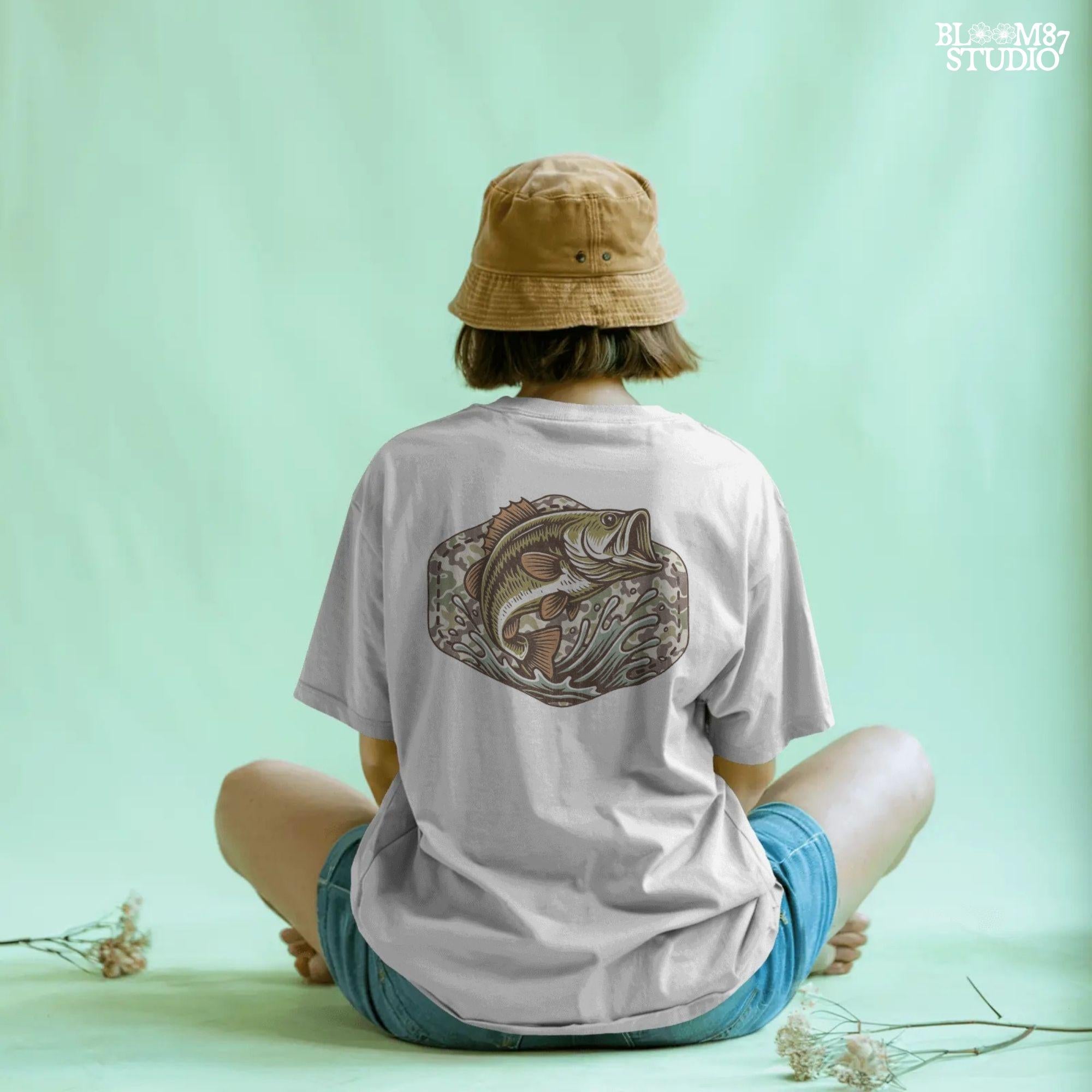 Jumping bass fish over camouflage background with splashing water, perfect for summer fishing and patriotic outdoor-themed designs.