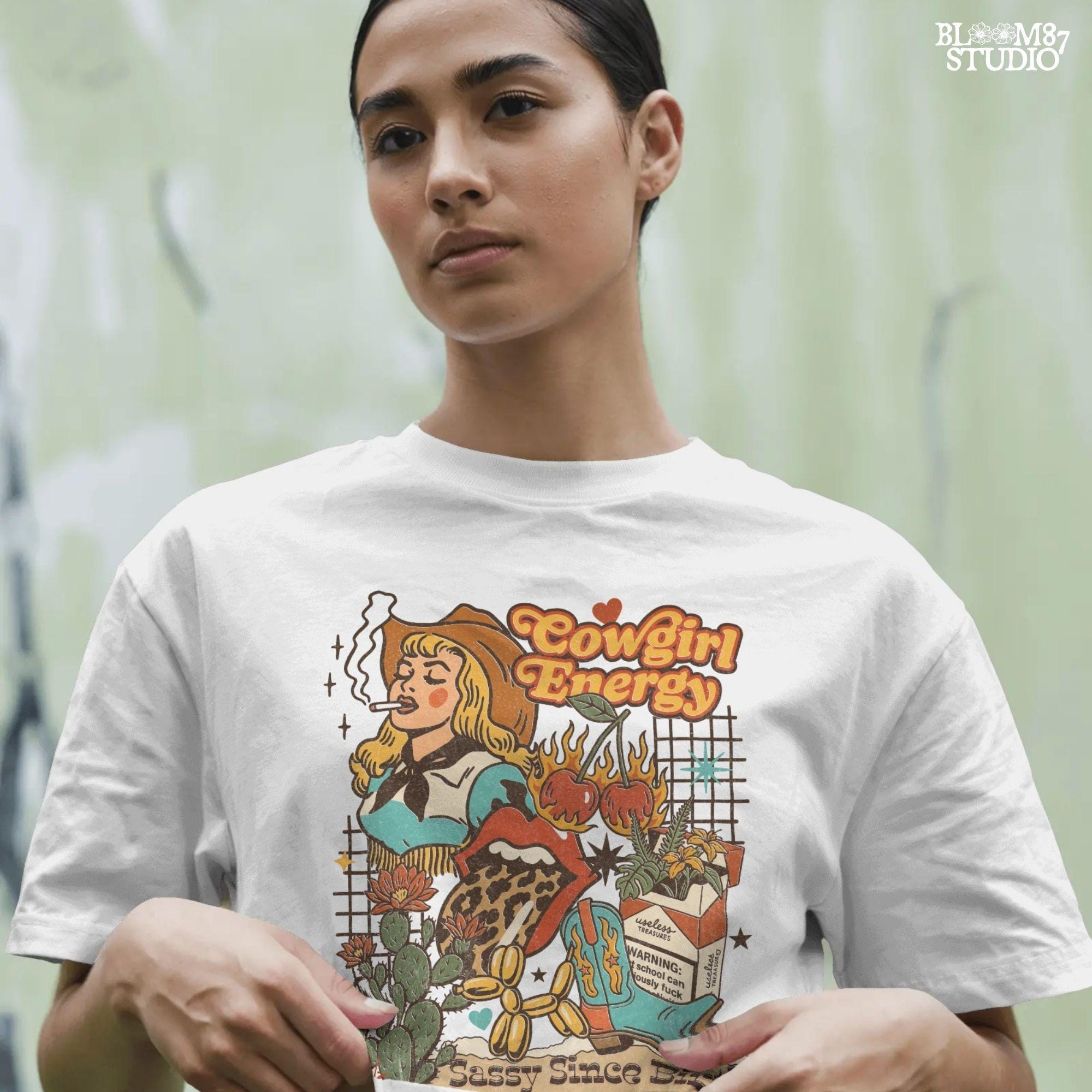 Retro cowgirl collage illustration with a blonde woman smoking, cowboy boots, cactus, leopard lips, cherries on fire, and wild western elements in bold vintage colors.