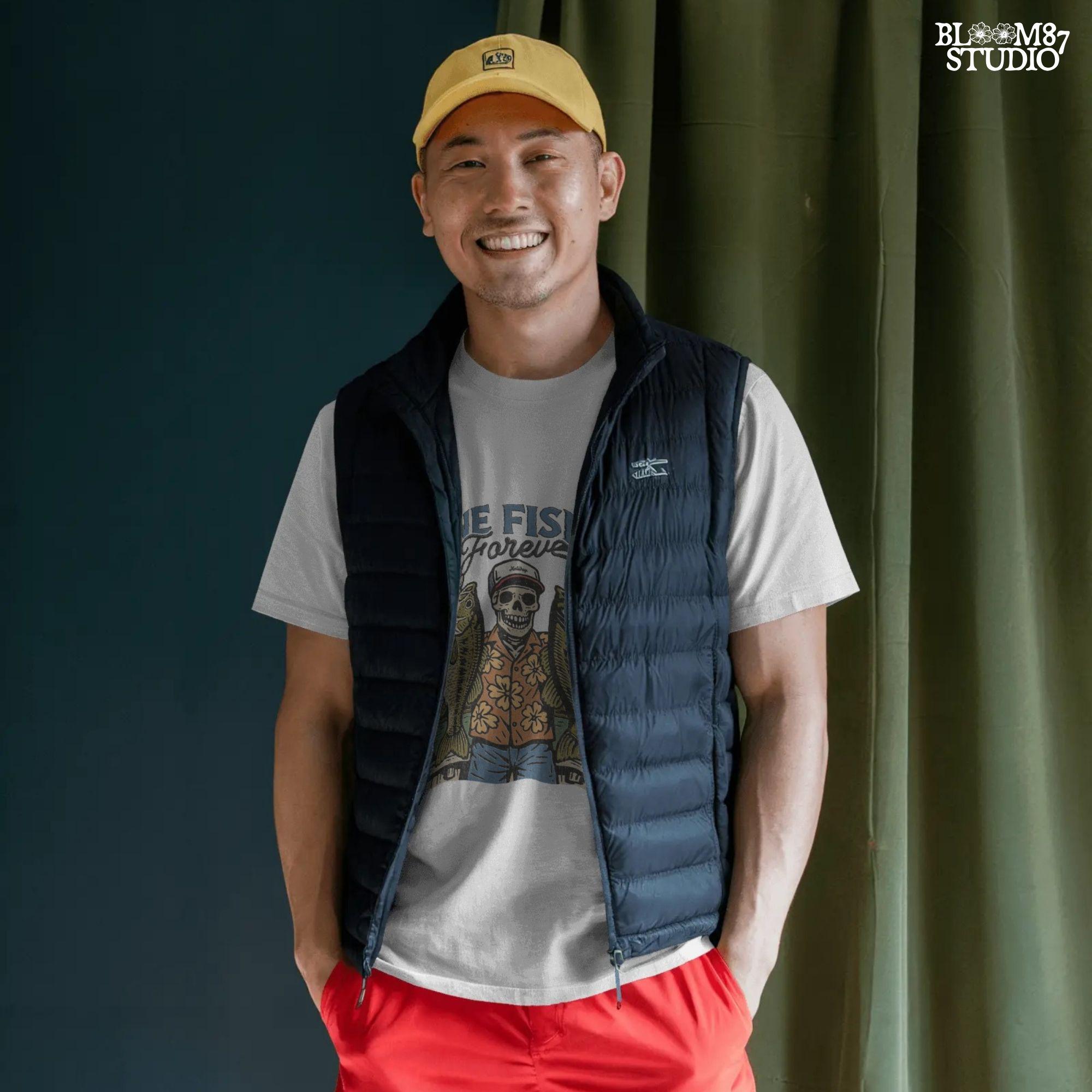 A skeleton wearing a red cap and orange floral shirt stands on a dock holding two large bass fish with the words “Gone Fishin’ Forever” above.