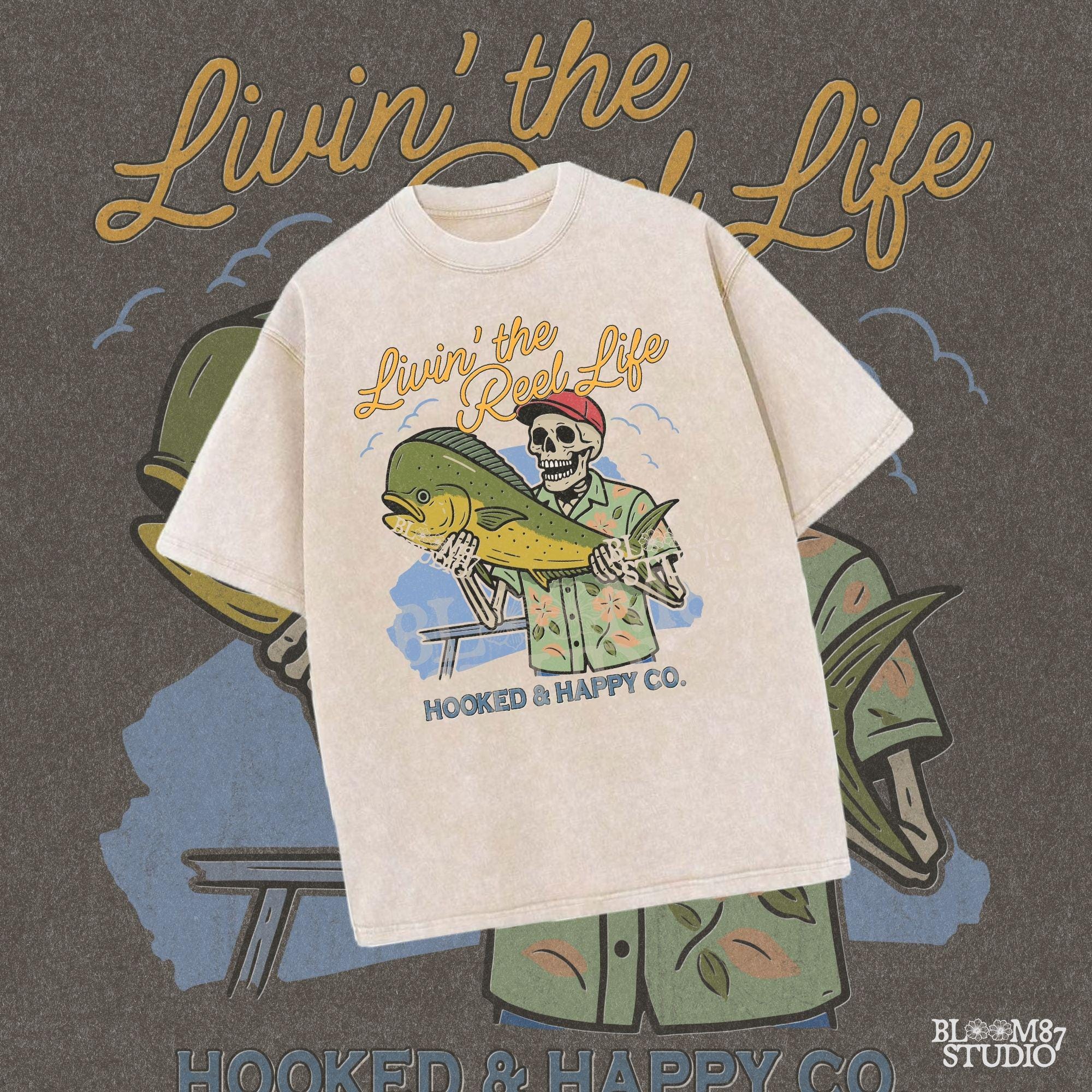 Cartoon skeleton in tropical shirt holding a mahi-mahi fish with text “Livin’ the Reel Life” above and “Hooked & Happy Co.” below.