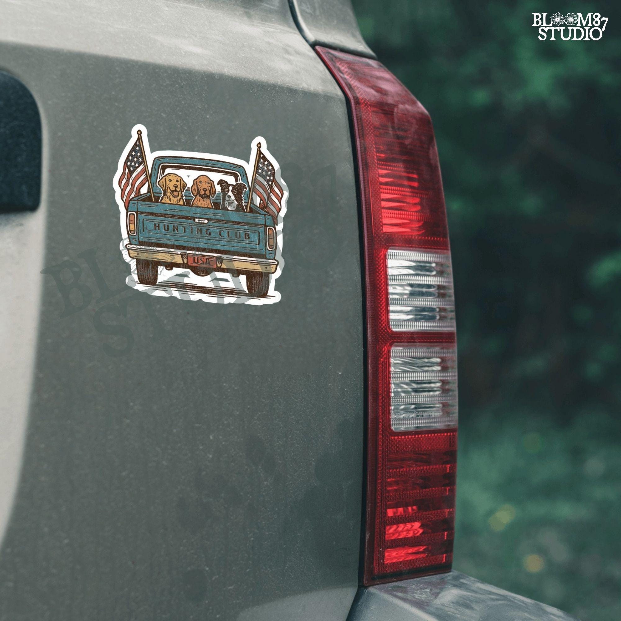 Three hunting dogs in the back of a blue vintage pickup truck with USA flags and “Hunting Club” text, patriotic hunting design for dog lovers.