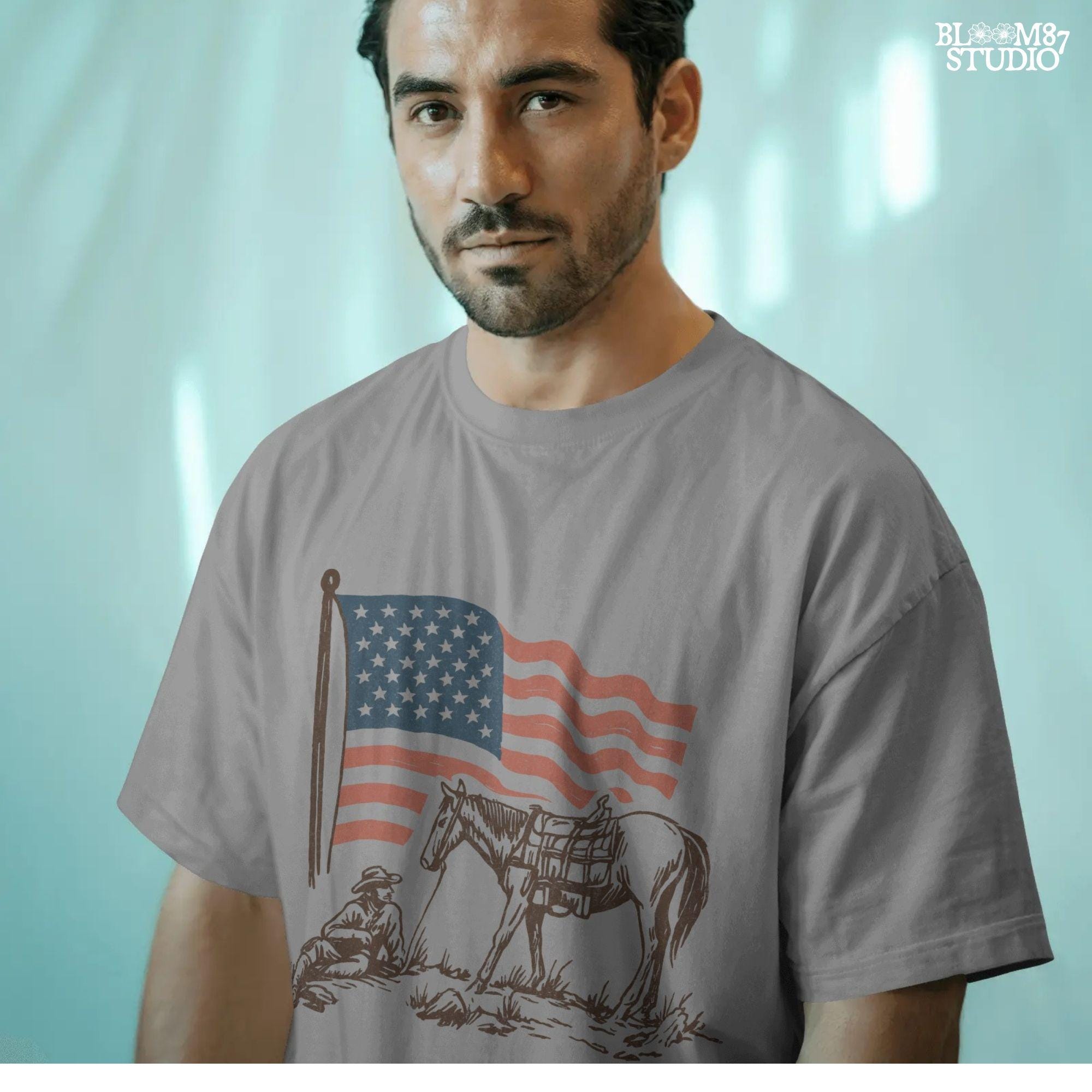 Vintage-style illustration of a cowboy sitting beside a saddled horse under a waving American flag.