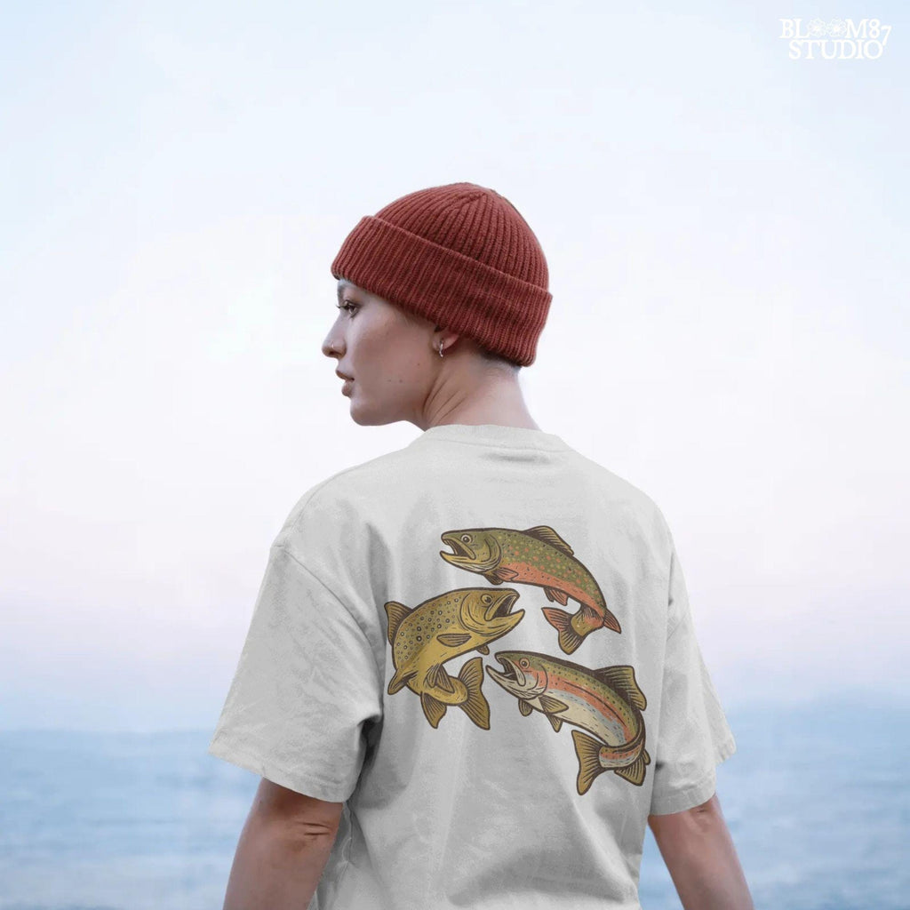 Illustration of rainbow trout, brook trout, and brown trout in colorful, vintage-style drawing with open mouths and detailed markings.