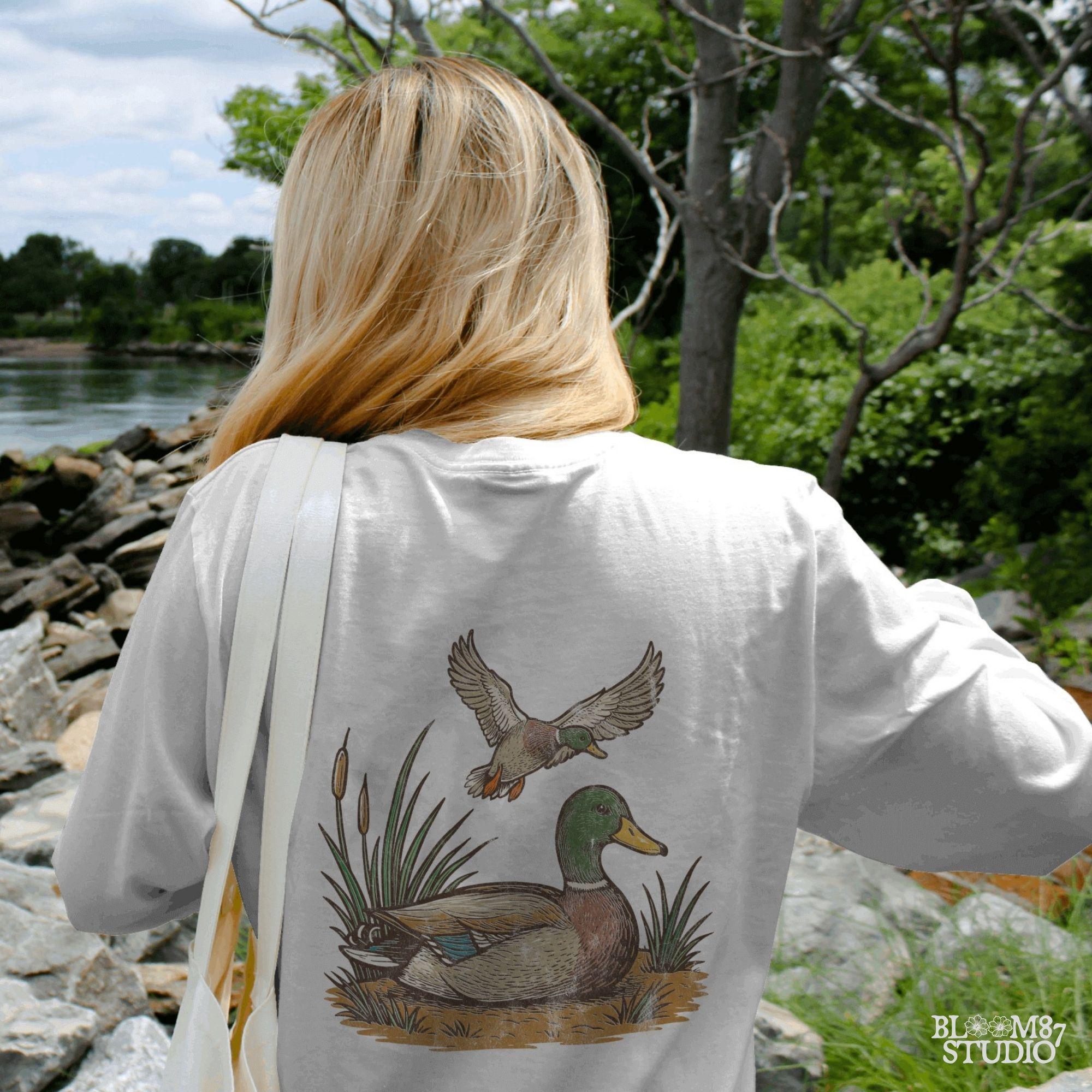 "Vintage mallard duck clipart PNG with flying and sitting ducks in marsh scene, perfect for duck hunting shirt sublimation or rustic wildlife designs"