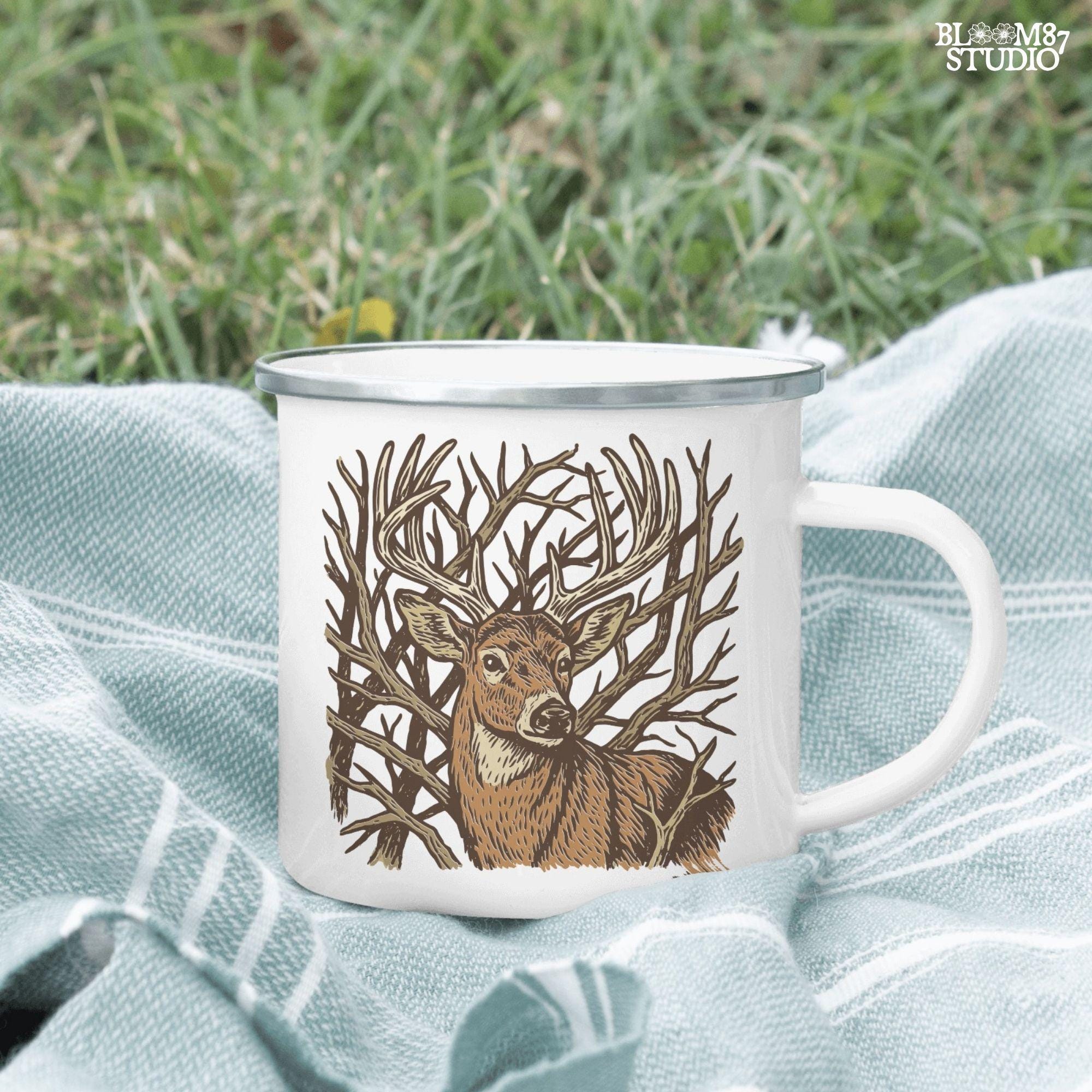 Hand-drawn whitetail deer with large antlers surrounded by bare woodland branches in earthy brown tones on a transparent background.