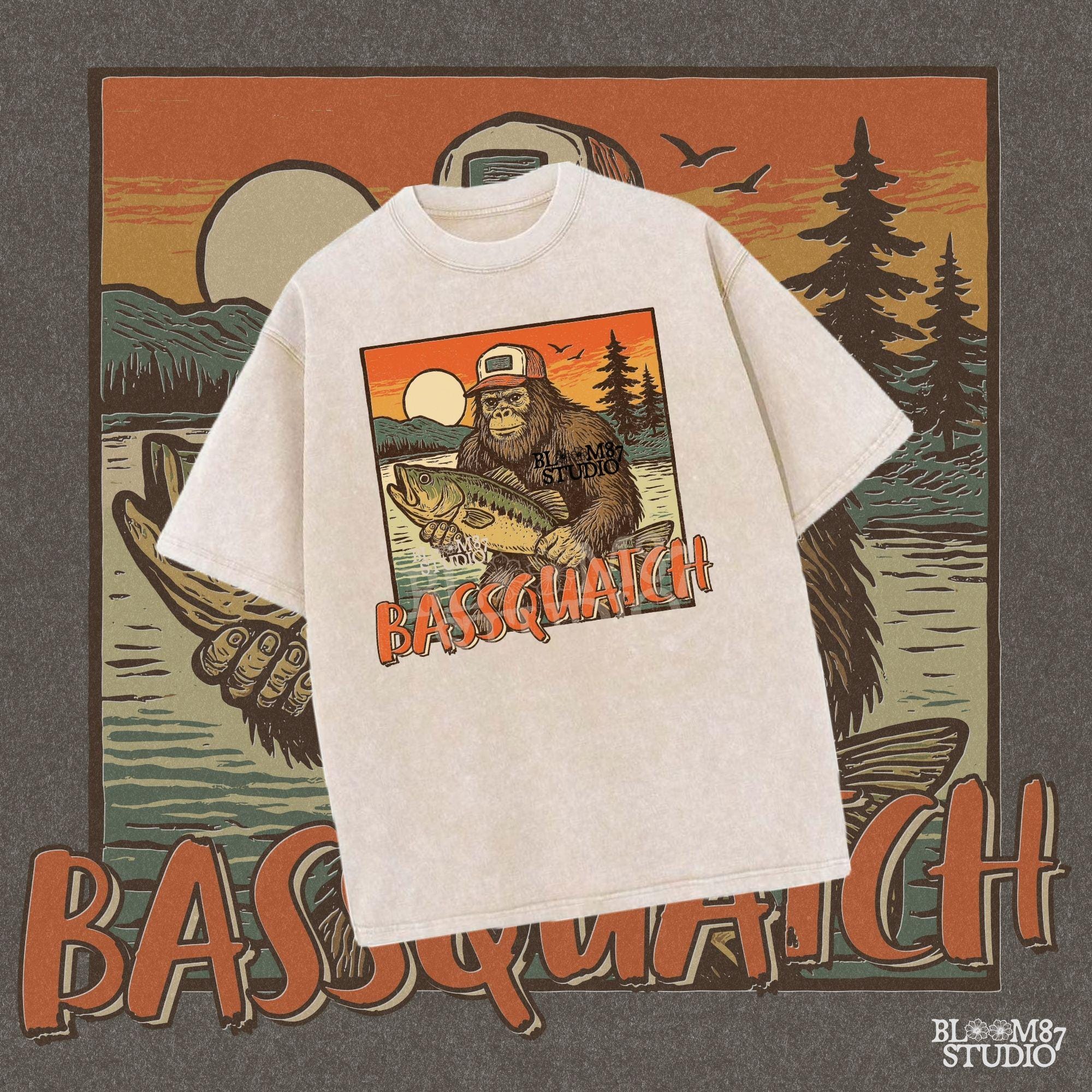 Bigfoot holding a large bass at sunset with summer lake background and the word “Bassquatch” in bold orange letters.
