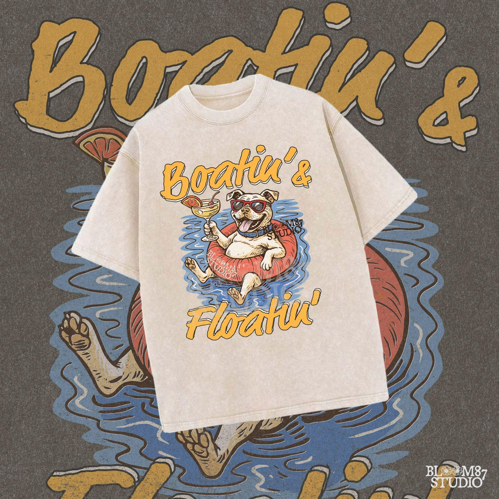 Cartoon bulldog in red sunglasses floating on a tube, holding a margarita, with “Boatin’ & Floatin’” summer text.