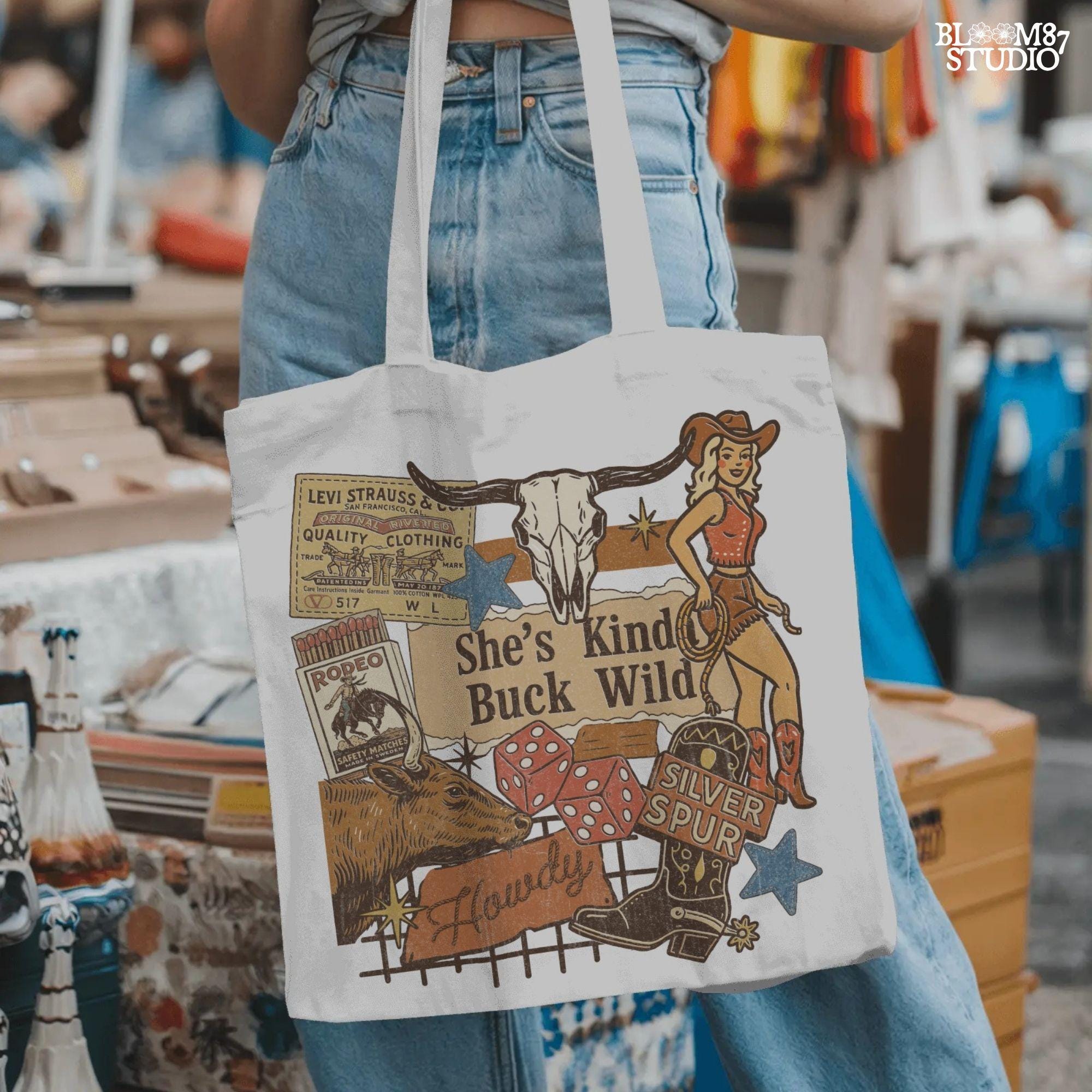 Retro Western howdy collage PNG with cowgirl, skull, dice, boots, bull, and text “She’s Kinda Buck Wild” – vintage rodeo sublimation design.
