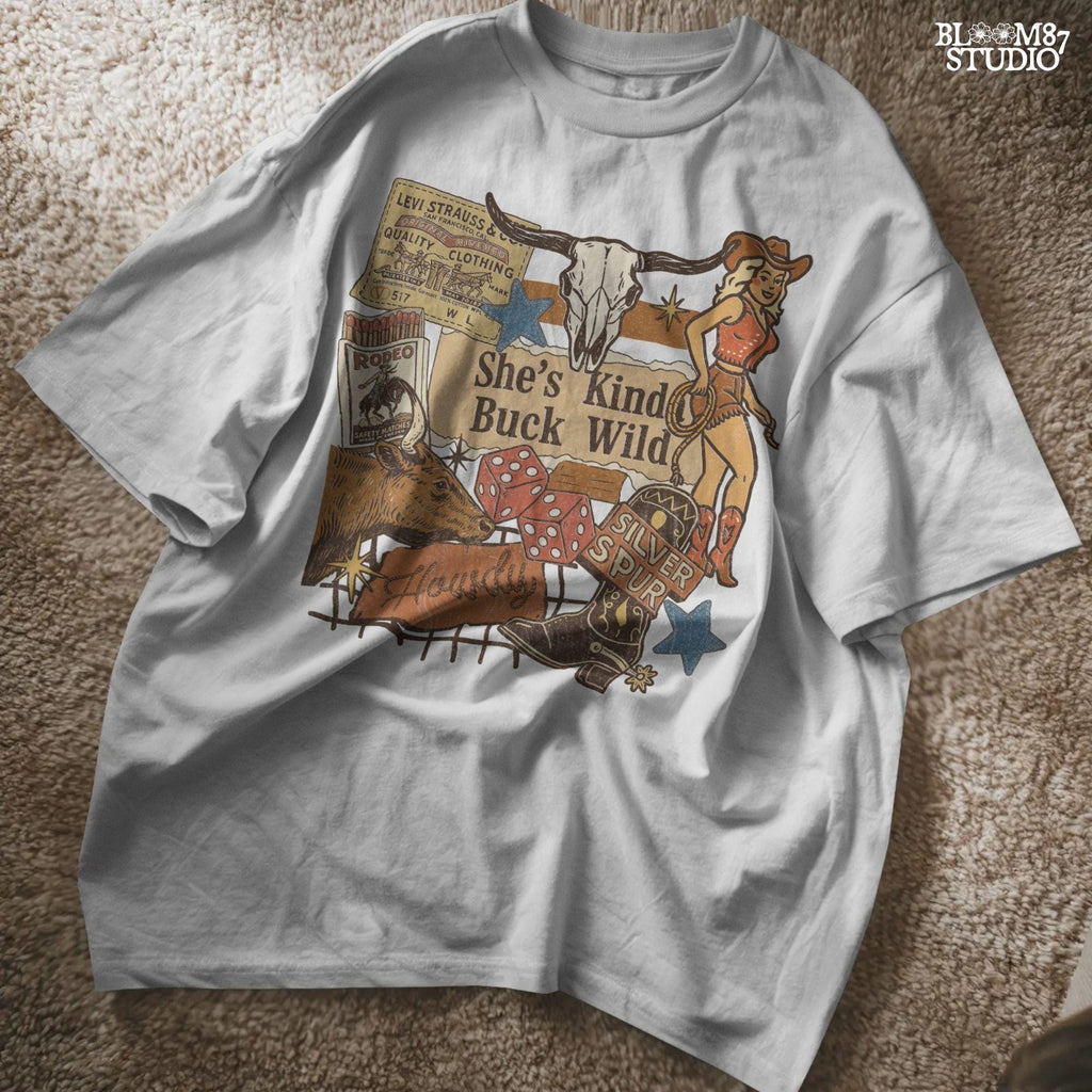 Retro Western howdy collage PNG with cowgirl, skull, dice, boots, bull, and text “She’s Kinda Buck Wild” – vintage rodeo sublimation design.