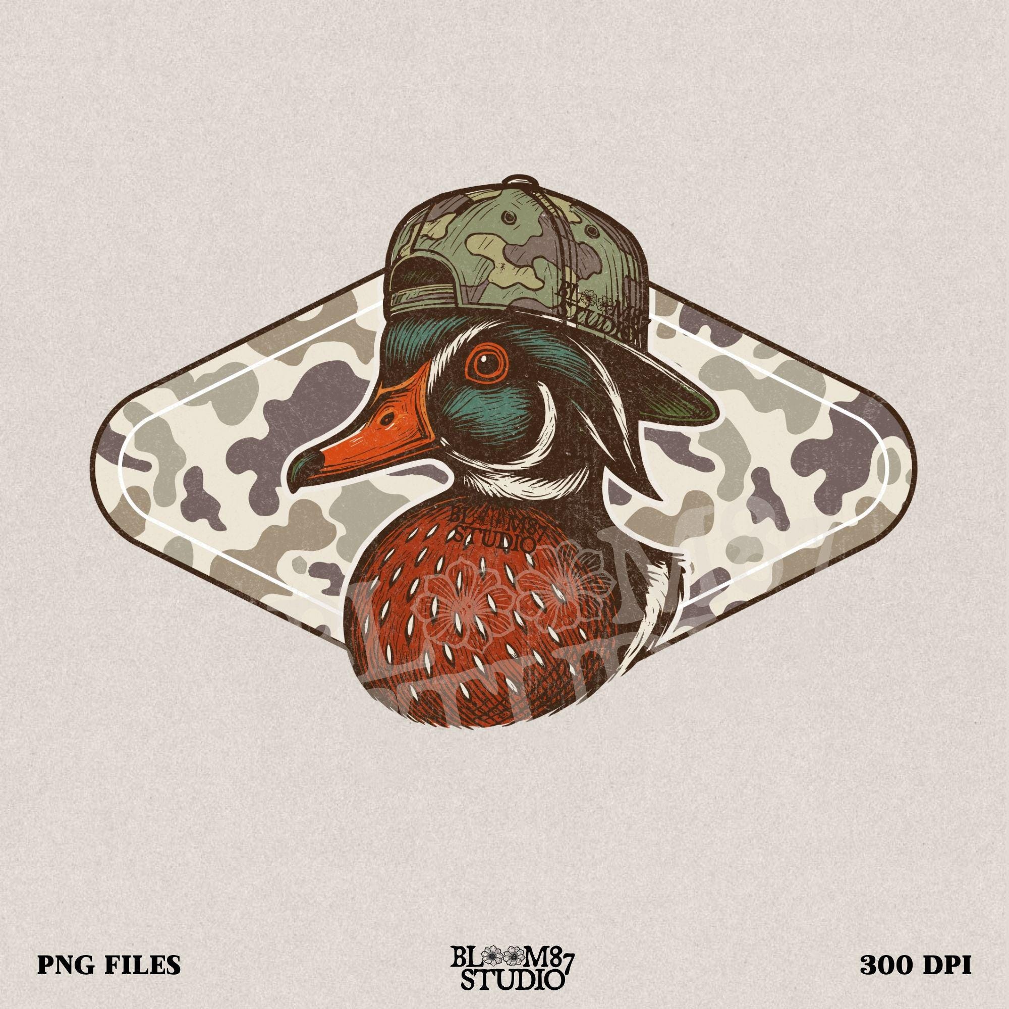 Funny wood duck wearing camo hat in front of marsh camo background – southern hunting sublimation design.