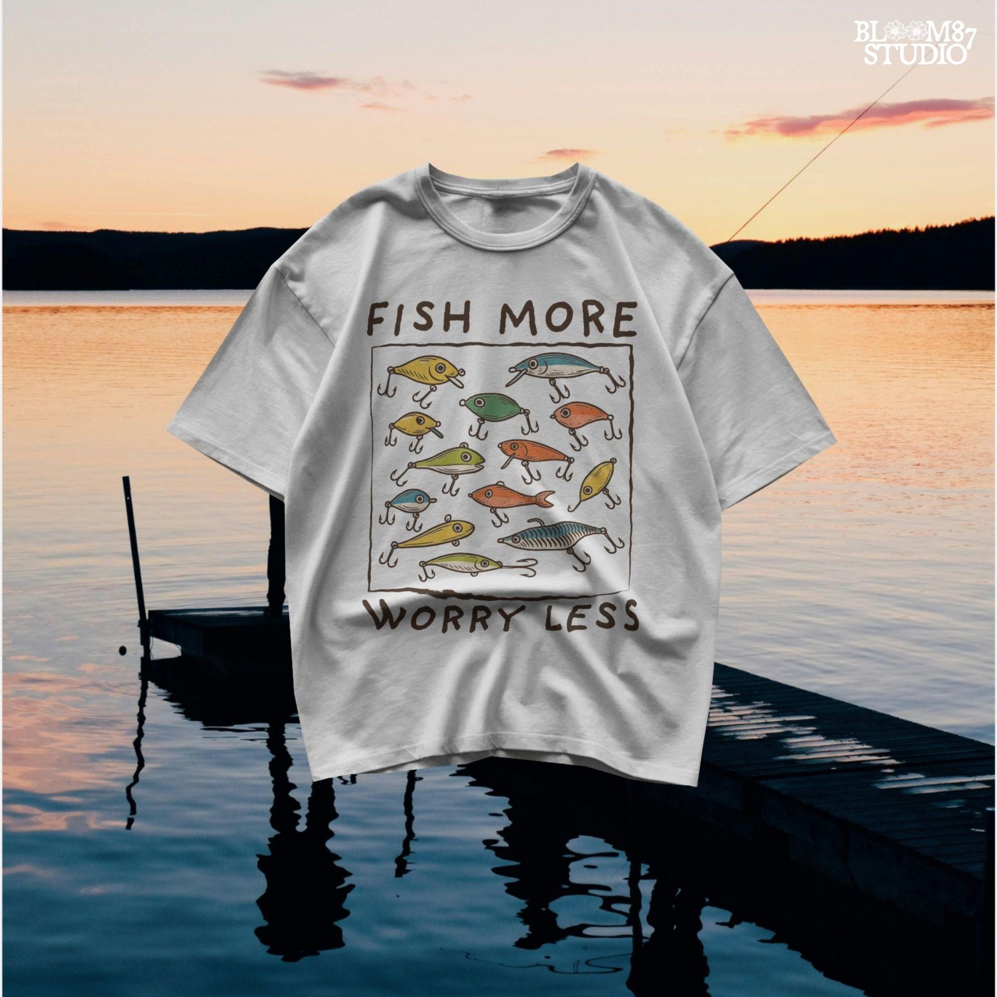 Hand-drawn vintage fishing lures with “Fish More Worry Less” quote in rustic outdoor style, colorful PNG for sublimation.
