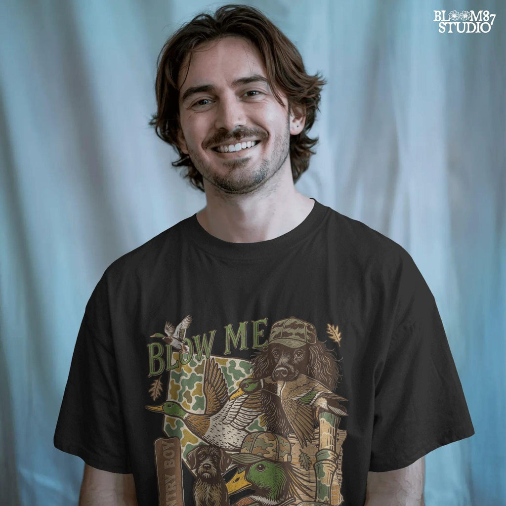 Retro collage of duck hunting elements including mallards, camo, duck dog, country boy rifle, and “Blow Me” southern humor quote.