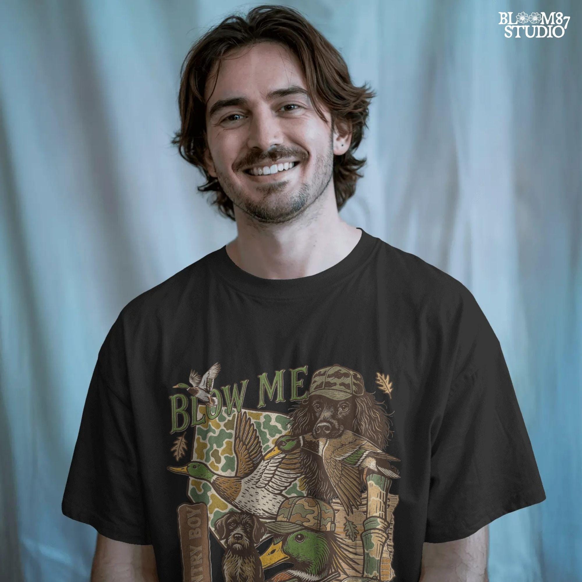 Retro collage of duck hunting elements including mallards, camo, duck dog, country boy rifle, and “Blow Me” southern humor quote.