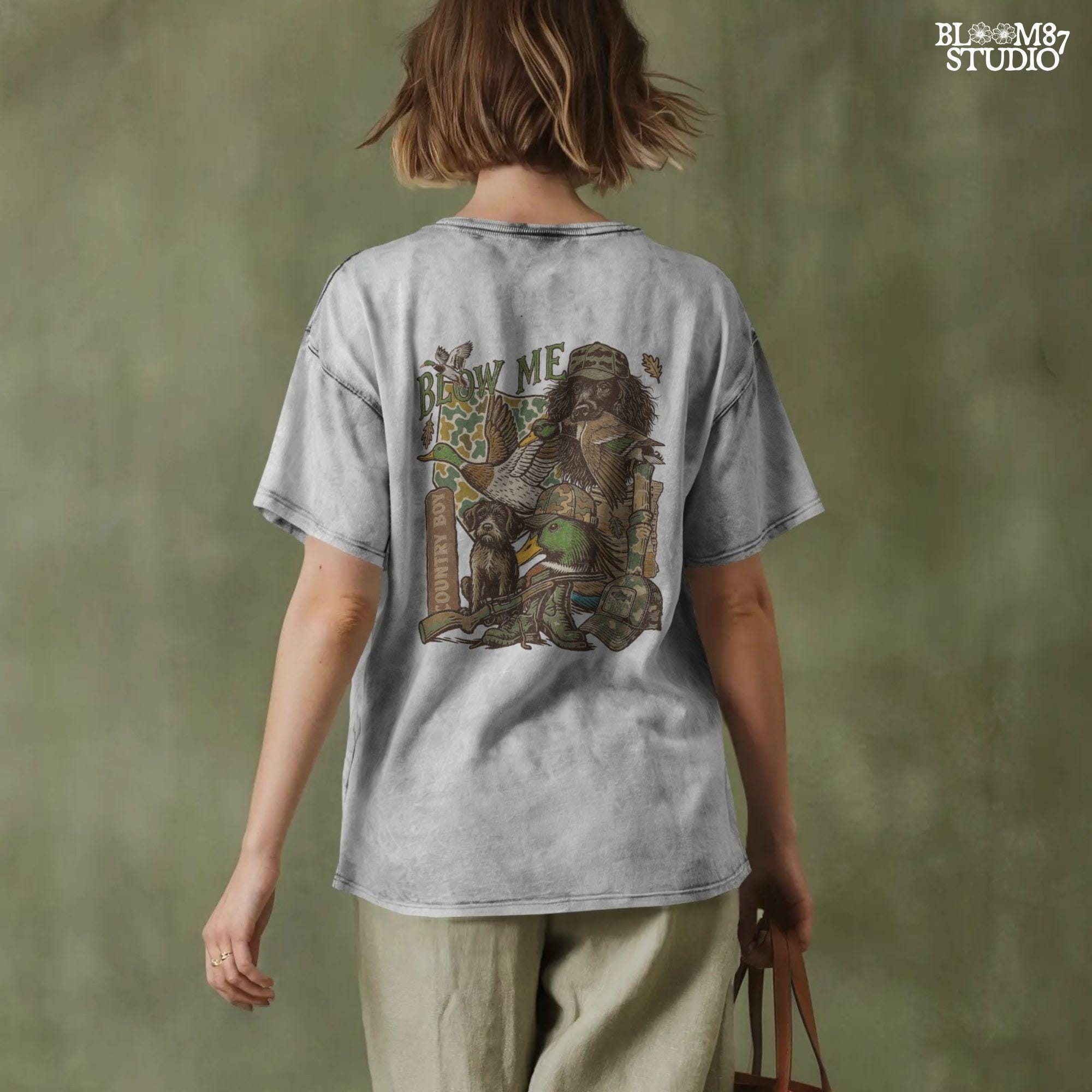 Retro collage of duck hunting elements including mallards, camo, duck dog, country boy rifle, and “Blow Me” southern humor quote.