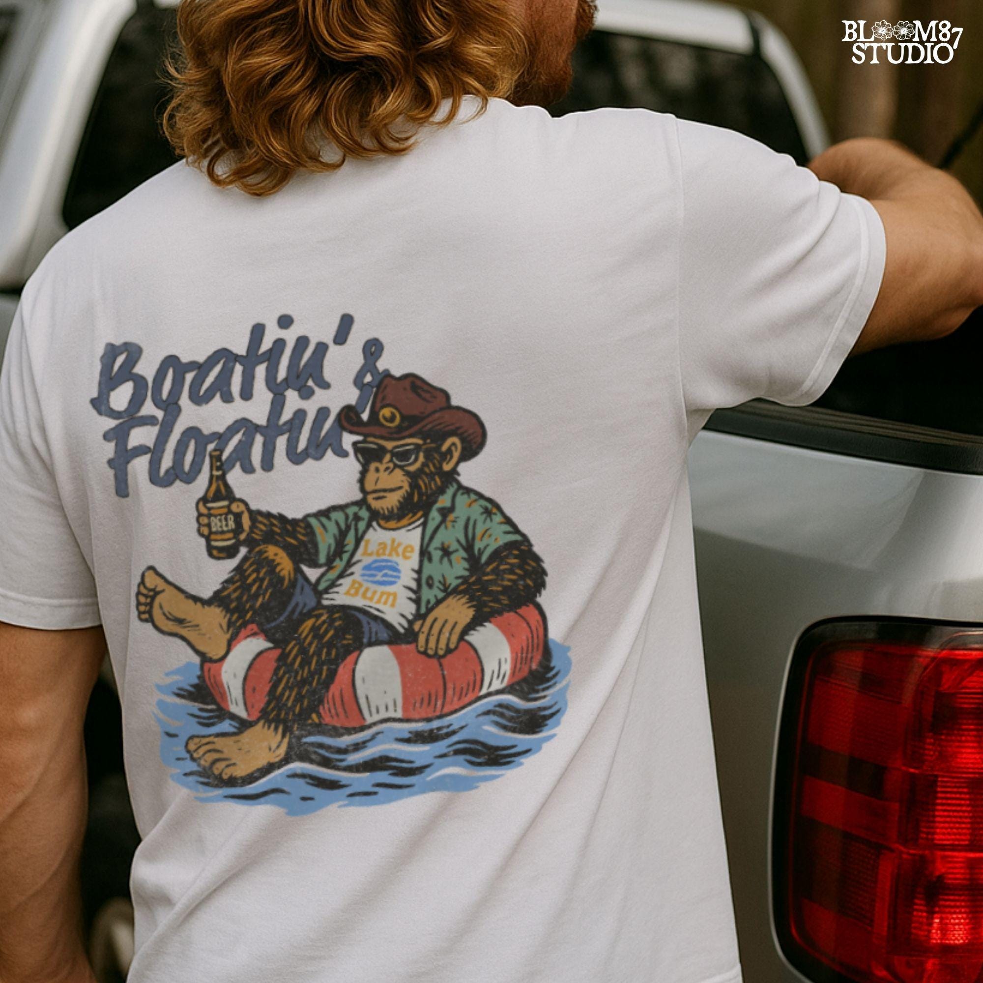 Bigfoot relaxing in a red and white pool float, holding a beer and wearing sunglasses, a hat, and a tropical shirt with “Boatin’ & Floatin’” text above.